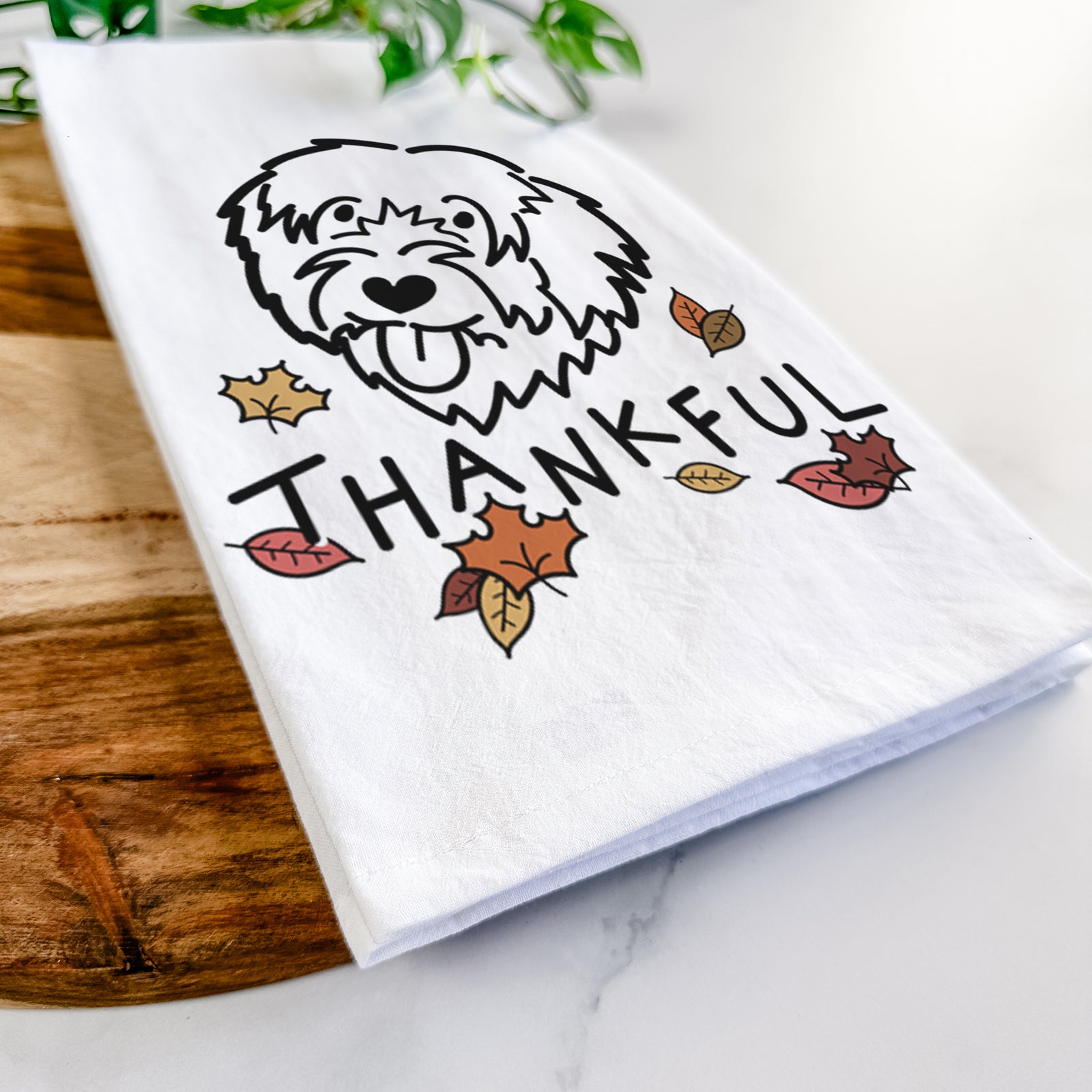 Minimalist line drawing of a Catalan Sheepdog with 'Thankful' lettering on a tea towel