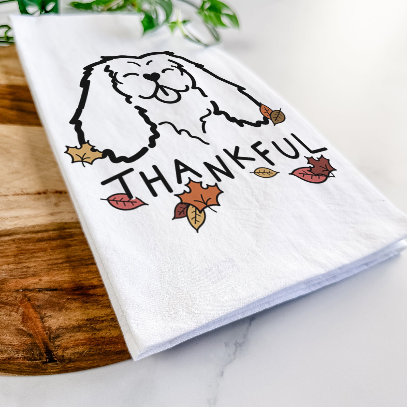Minimalist line drawing of a Cavalier King Charles Spaniel with 'Thankful' lettering on a tea towel