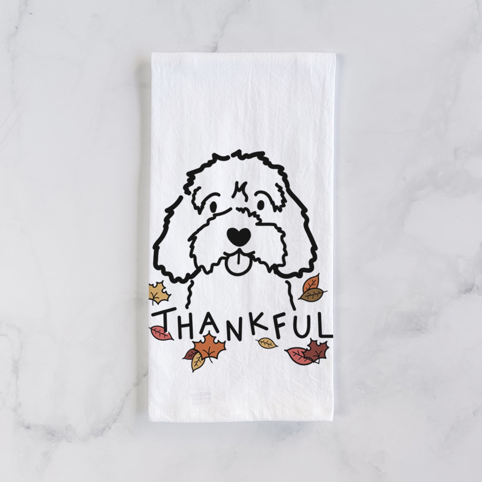 Minimalist line drawing of a Cavapoo with 'Thankful' lettering on a tea towel