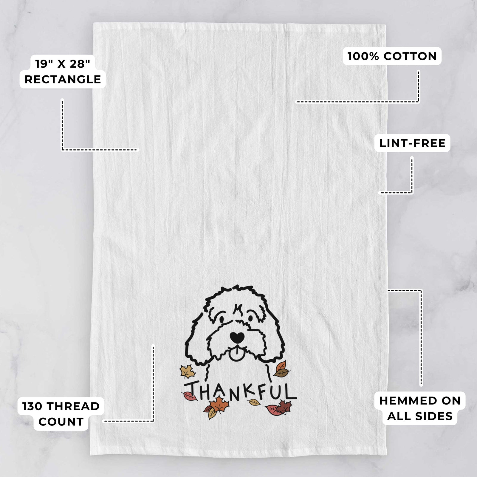 Minimalist line drawing of a Cavapoo with 'Thankful' lettering on a tea towel, with feature callouts: 19 x 28 inch rectangle, 100% cotton, lint-free, 120 thread count, hemmed on all sides