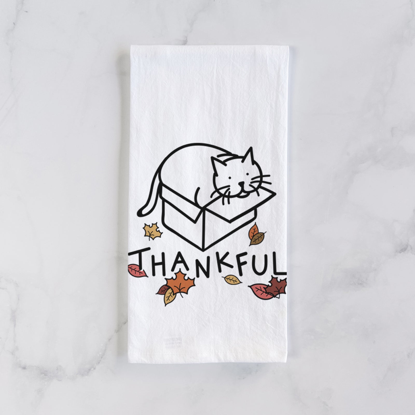 Minimalist line drawing of Charlie the Cat in a Box with 'Thankful' lettering on a tea towel