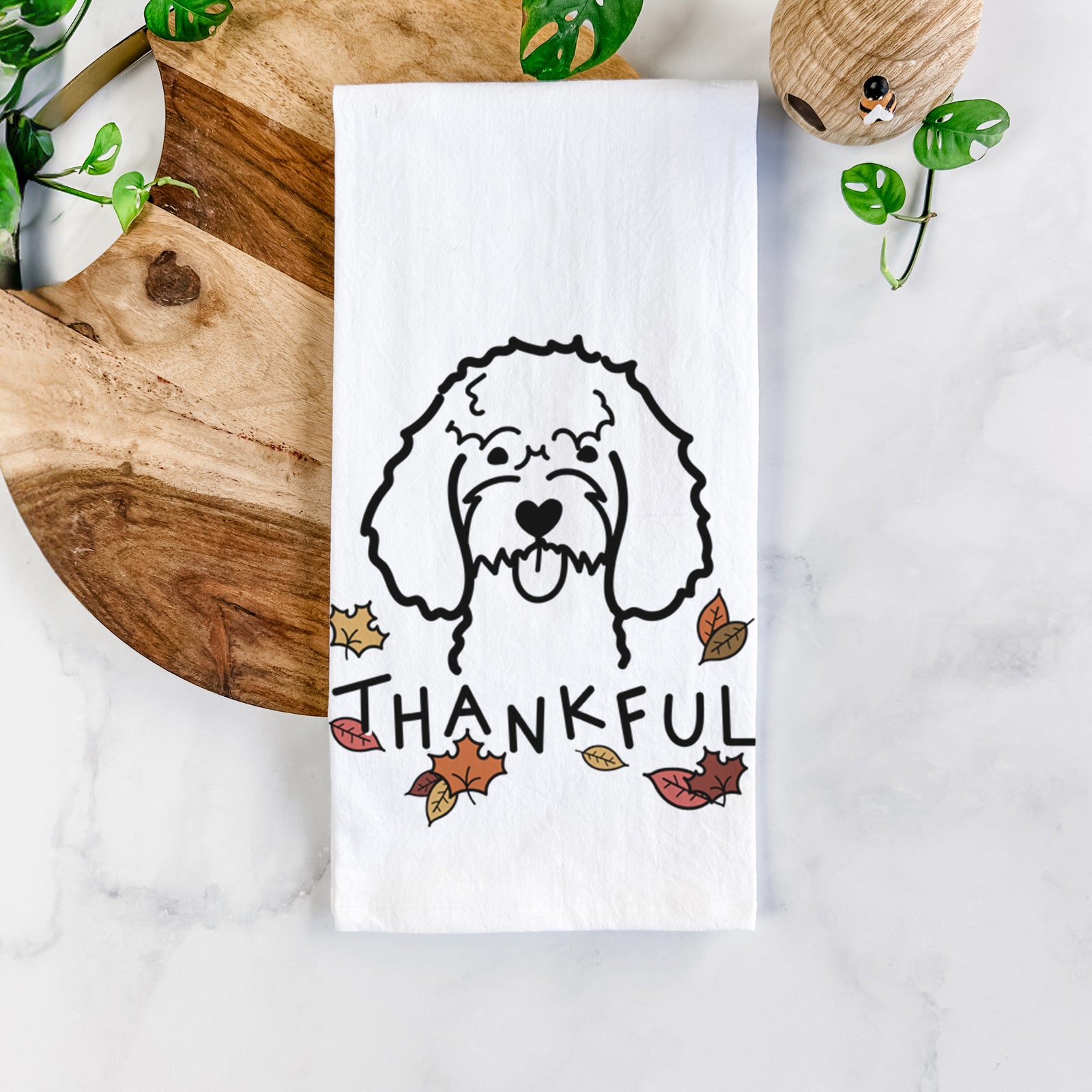Minimalist line drawing of a Cockapoo with 'Thankful' lettering on a tea towel
