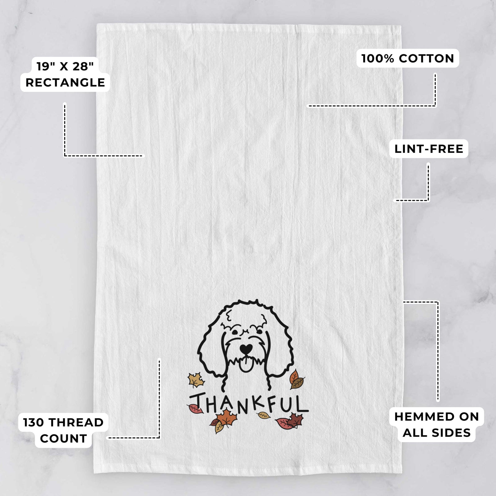 Minimalist line drawing of a Cockapoo with 'Thankful' lettering on a tea towel, with feature callouts: 19 x 28 inch rectangle, 100% cotton, lint-free, 120 thread count, hemmed on all sides