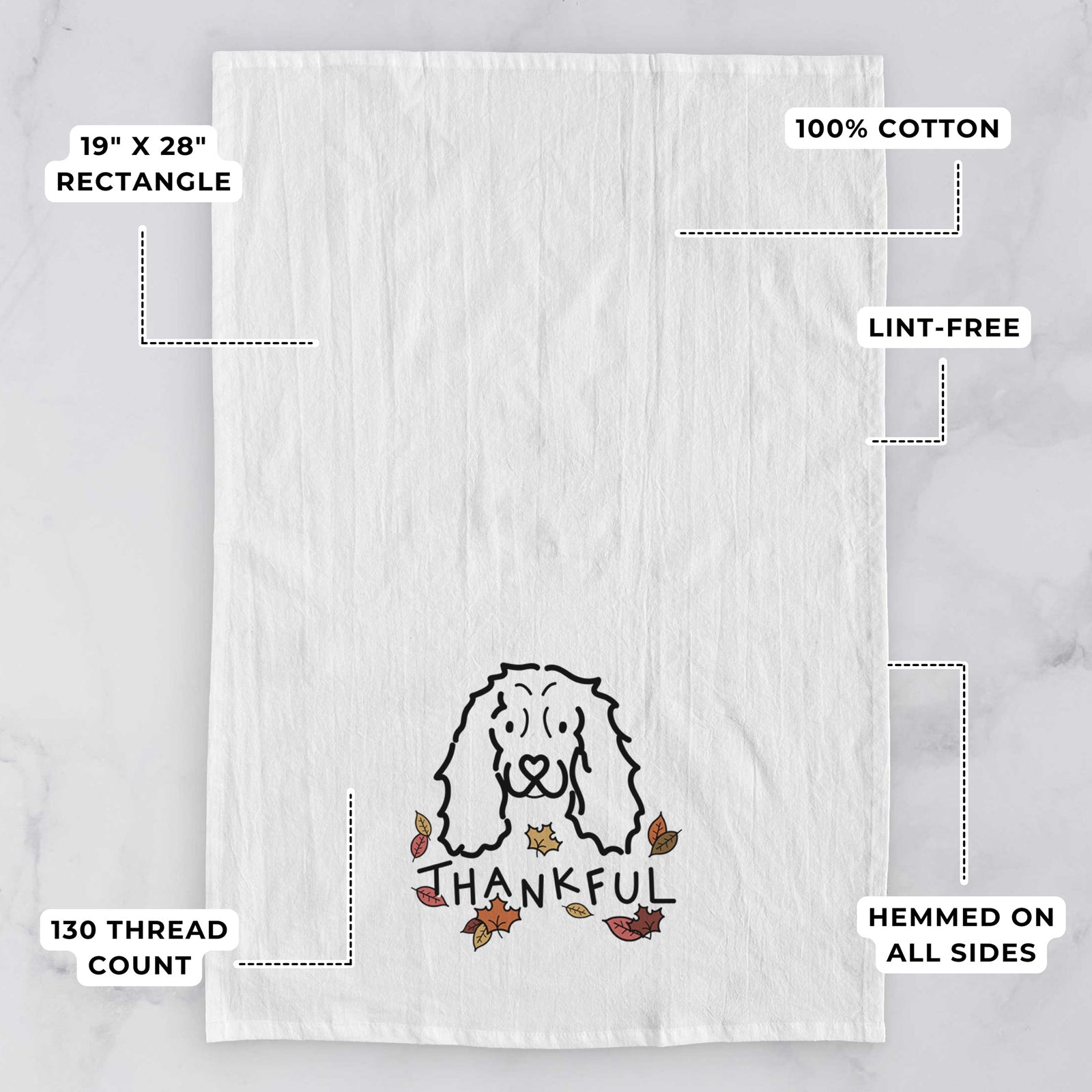 Minimalist line drawing of an American Cocker Spaniel with 'Thankful' lettering on a tea towel, with feature callouts: 19 x 28 inch rectangle, 100% cotton, lint-free, 120 thread count, hemmed on all sides
