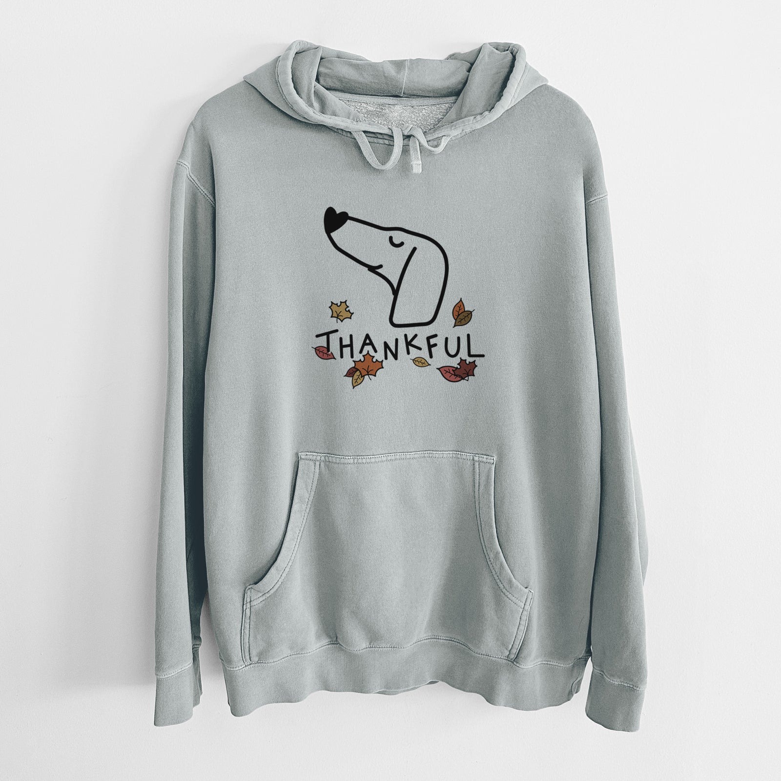 Minimalist line drawing of a Dachshund with 'Thankful' lettering on a Sage Unisex pigment dyed hoodie