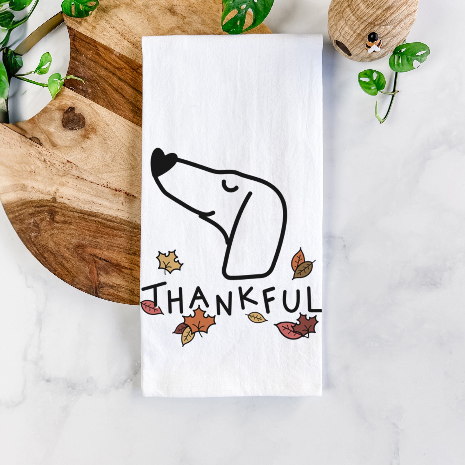 Minimalist line drawing of a Dachshund with 'Thankful' lettering on a tea towel
