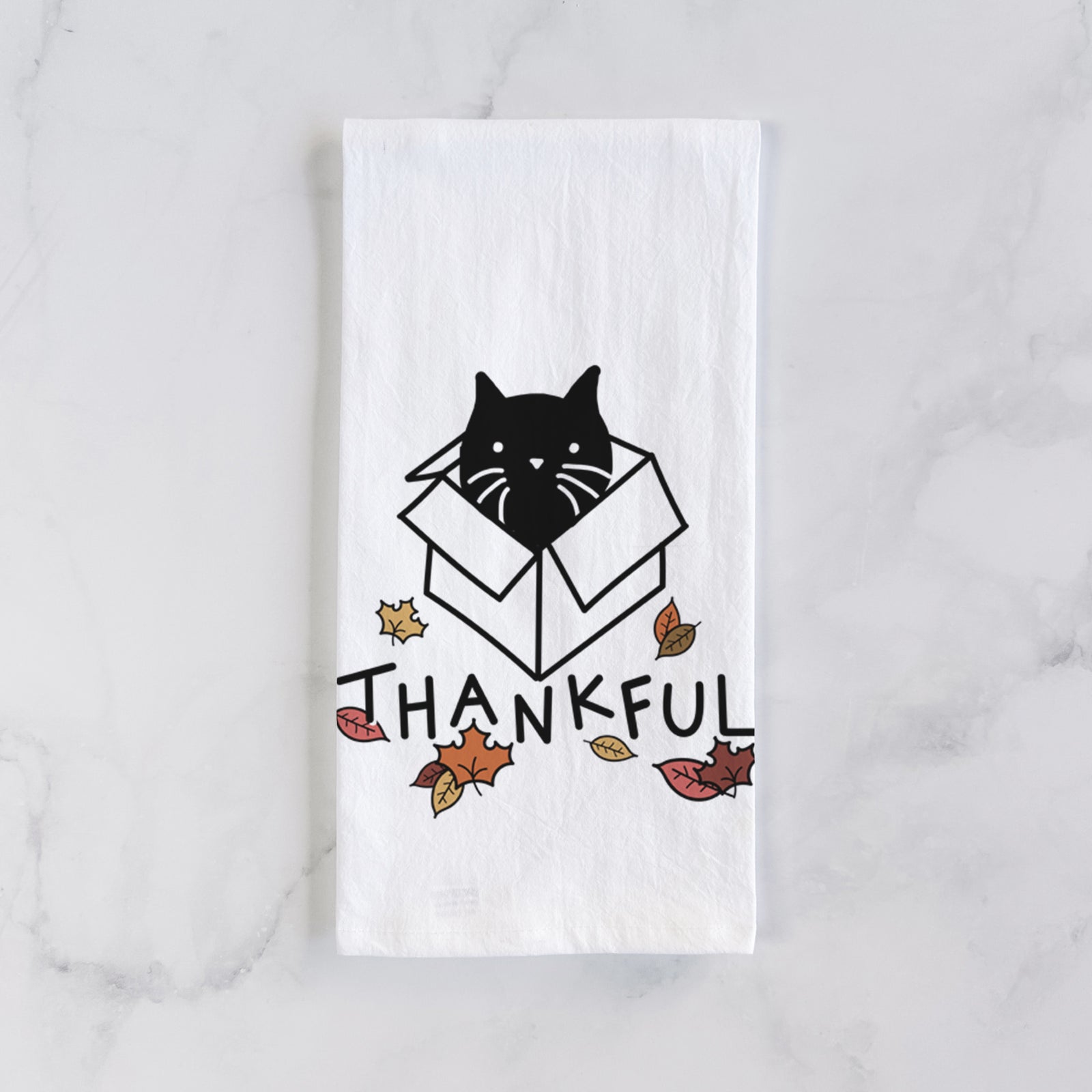 Minimalist line drawing of Doc the Black Cat in a Box with 'Thankful' lettering on a tea towel