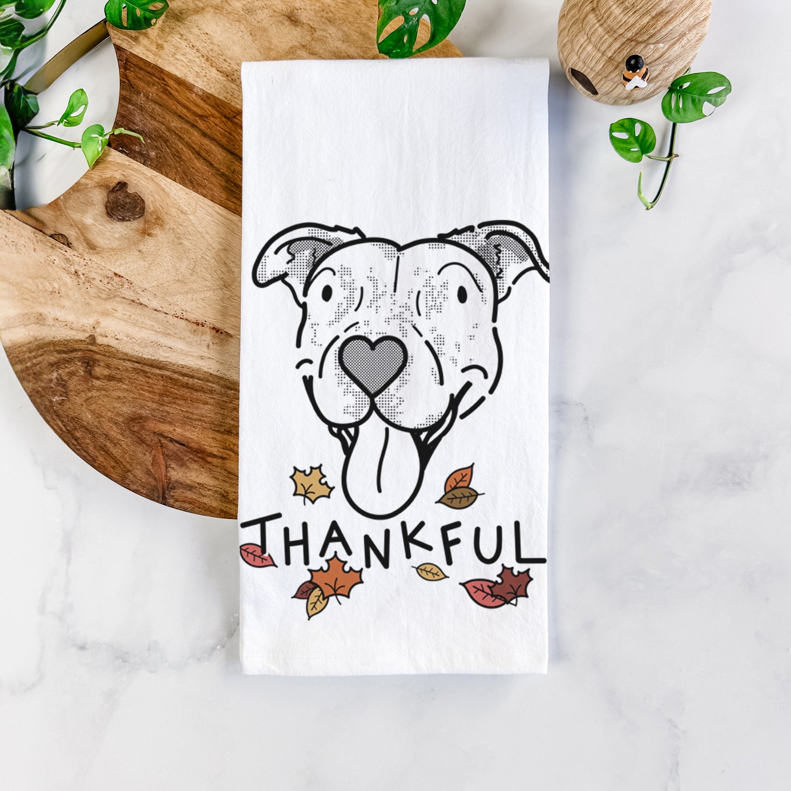 Minimalist line drawing of Dottie the Pitbull Mix with 'Thankful' lettering on a tea towel