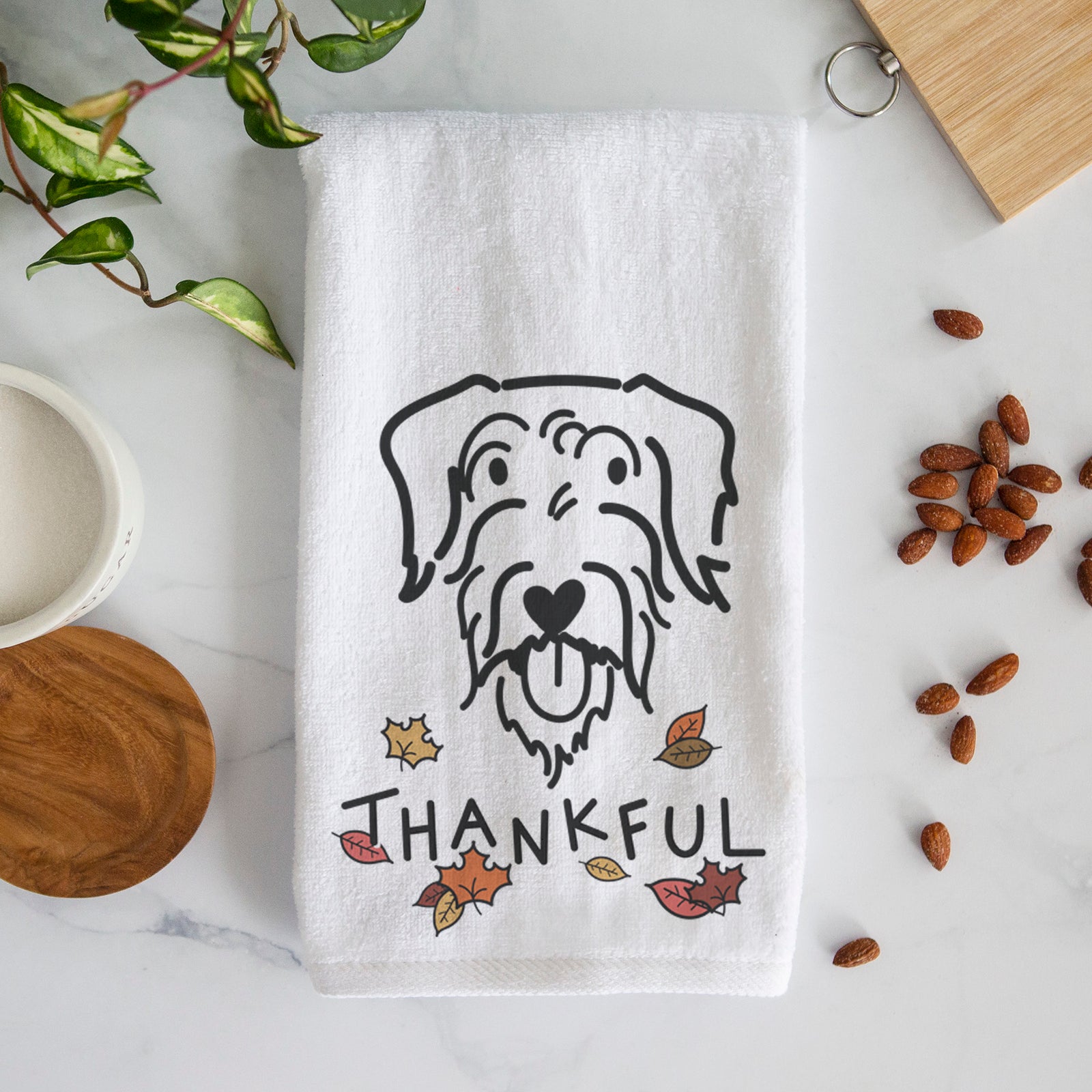 Minimalist line drawing of Dug the Doodle with 'Thankful' lettering on a decorative hand towel