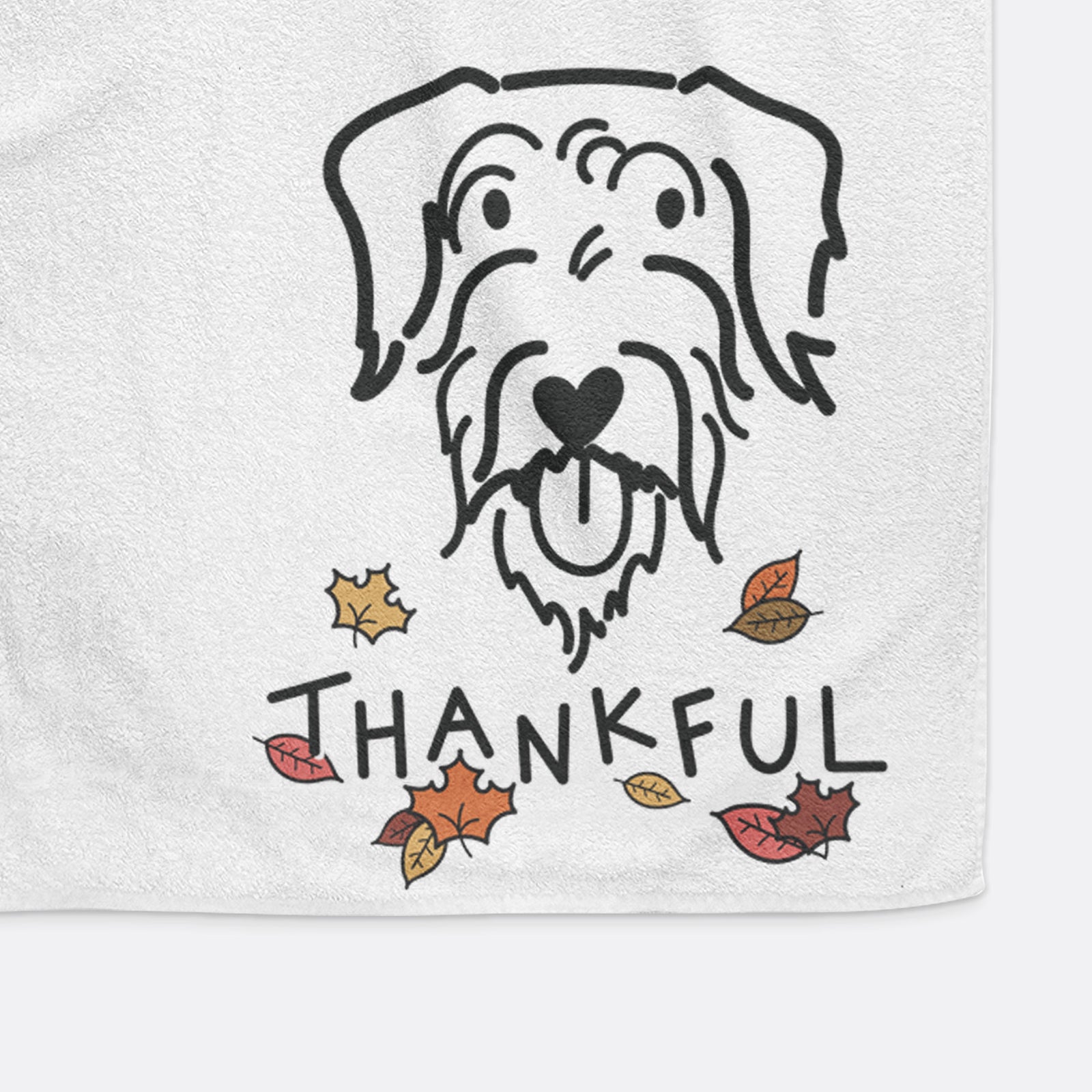 Minimalist line drawing of Dug the Doodle with 'Thankful' lettering on a decorative hand towel