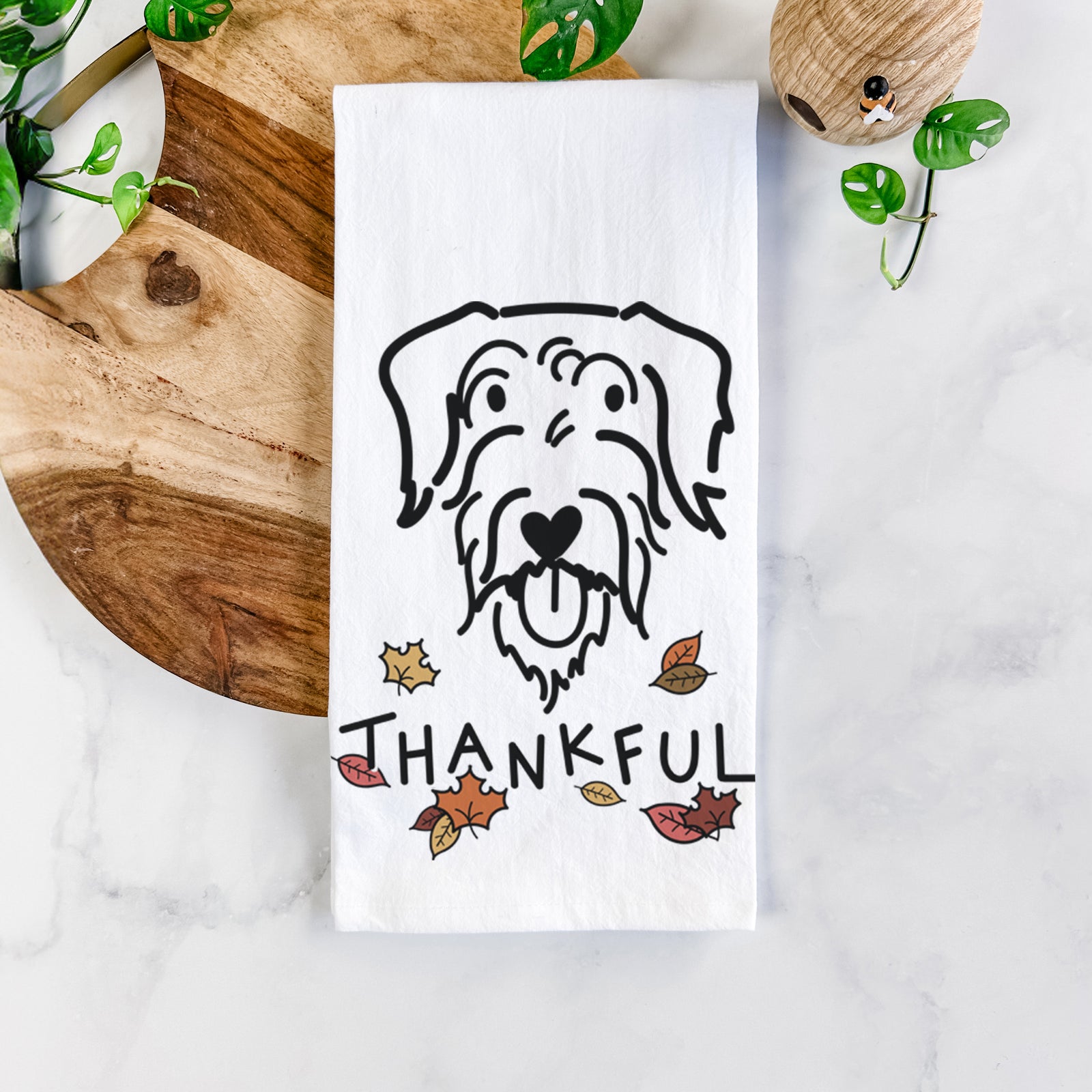 Minimalist line drawing of Dug the Doodle with 'Thankful' lettering on a tea towel