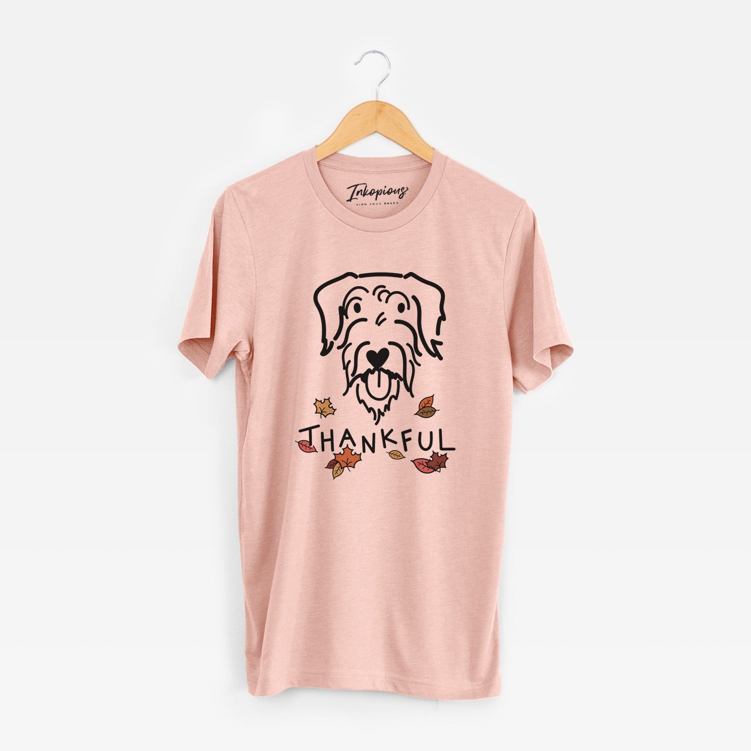 Minimalist line drawing of Dug the Doodle with 'Thankful' lettering on a Peach Unisex crewneck