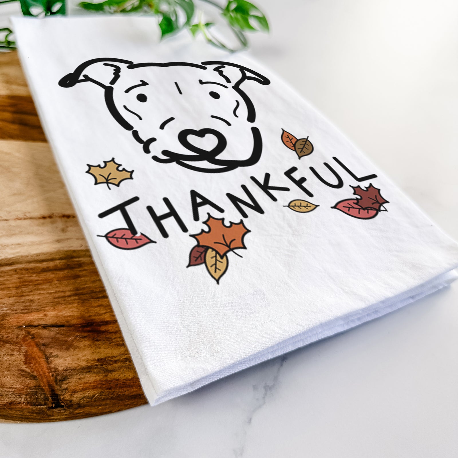 Minimalist line drawing of Ernie the Pitbull Mix with 'Thankful' lettering on a tea towel