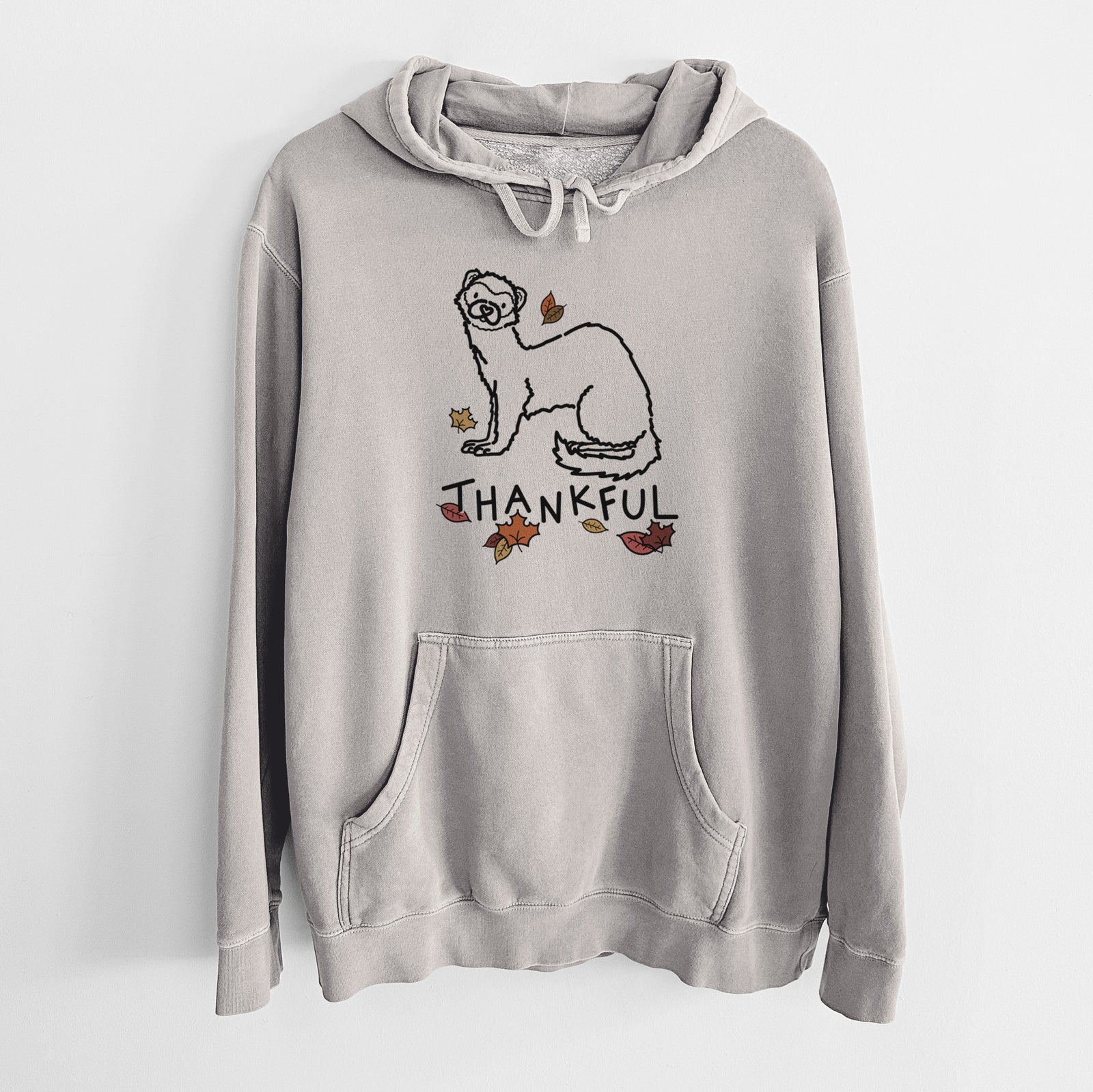 Minimalist line drawing of Fern the Ferret with 'Thankful' lettering on a Cement Unisex pigment dyed hoodie