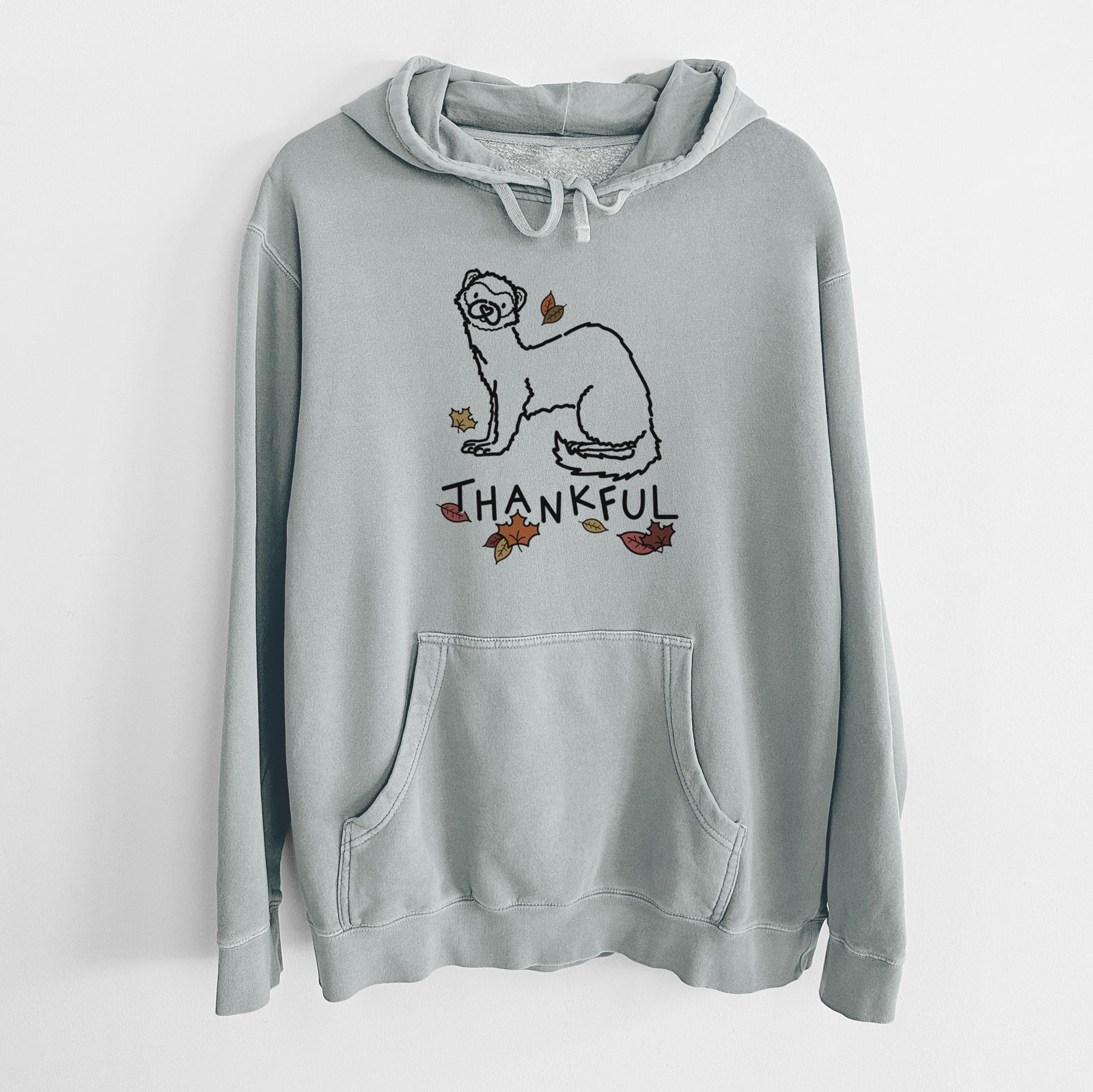 Minimalist line drawing of Fern the Ferret with 'Thankful' lettering on a Sage Unisex pigment dyed hoodie