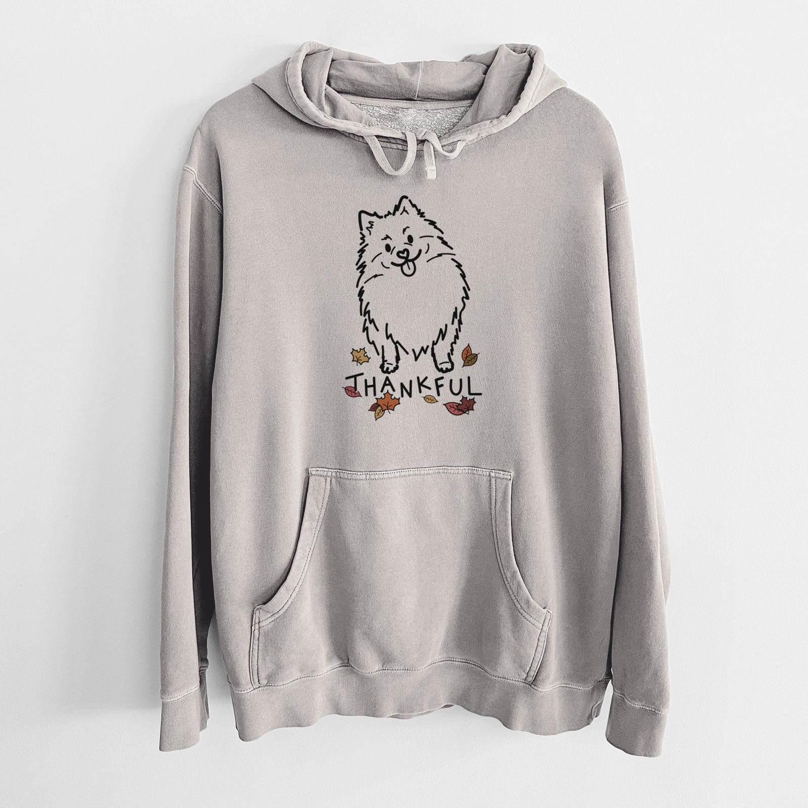 Minimalist line drawing of Fern the Pomeranian with 'Thankful' lettering on a Cement Unisex pigment dyed hoodie