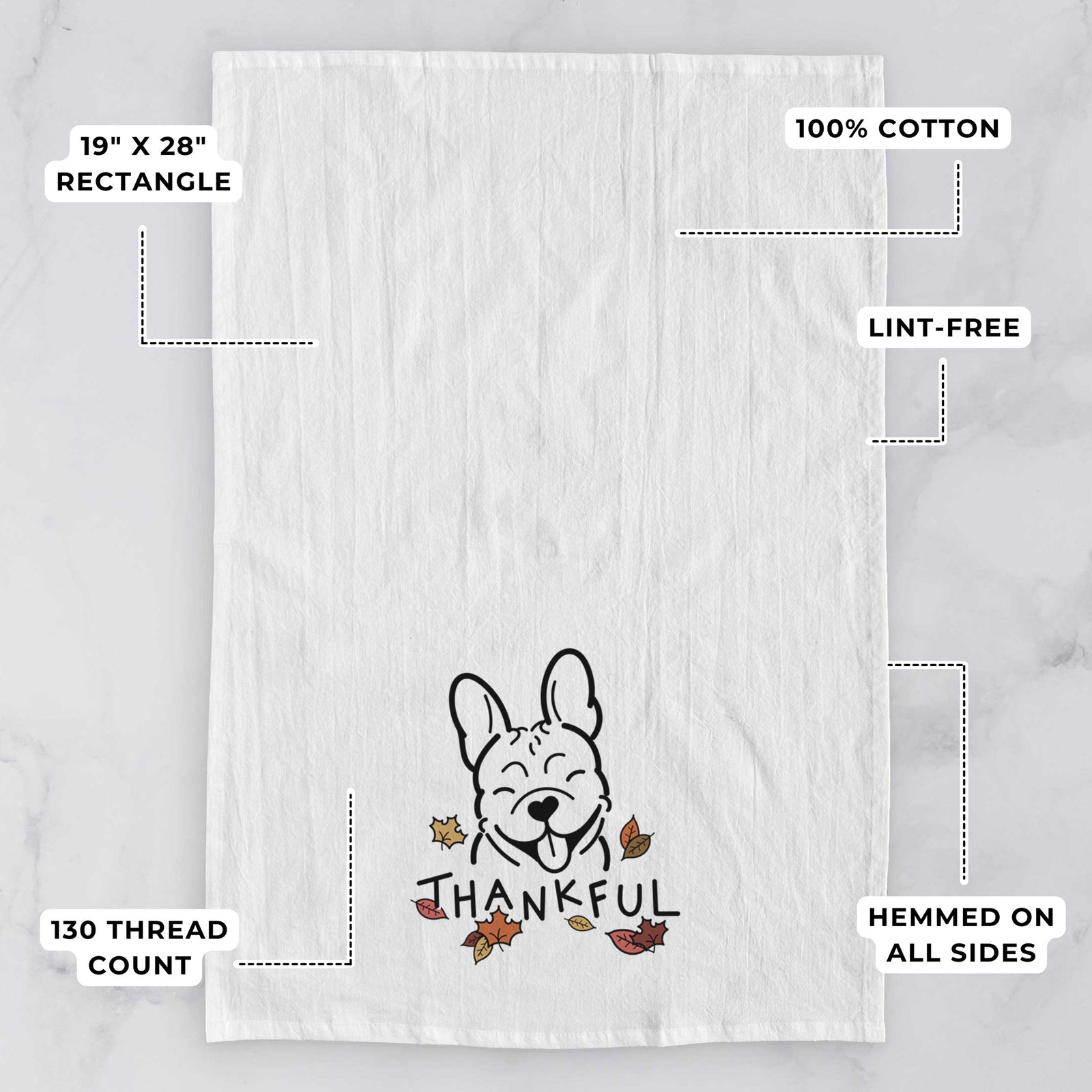 Minimalist line drawing of a French Bulldog with 'Thankful' lettering on a tea towel, with feature callouts: 19 x 28 inch rectangle, 100% cotton, lint-free, 120 thread count, hemmed on all sides