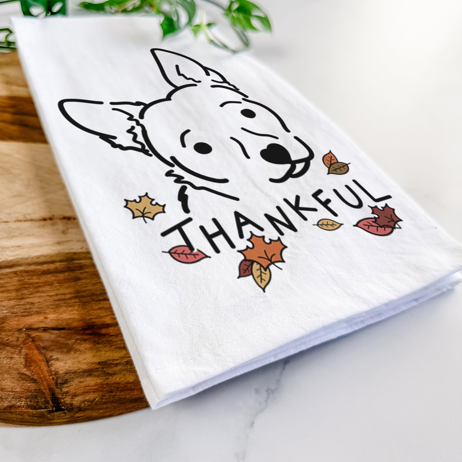 Minimalist line drawing of GiGi the Chihuahua Mix with 'Thankful' lettering on a tea towel