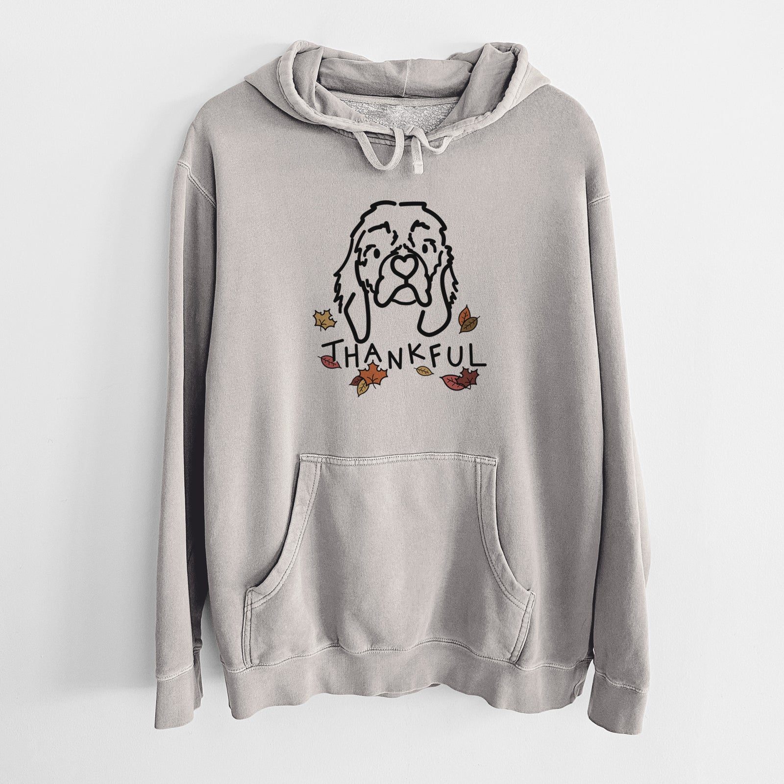 Minimalist line drawing of GiGi the Cocker Spaniel with 'Thankful' lettering on a Cement Unisex pigment dyed hoodie