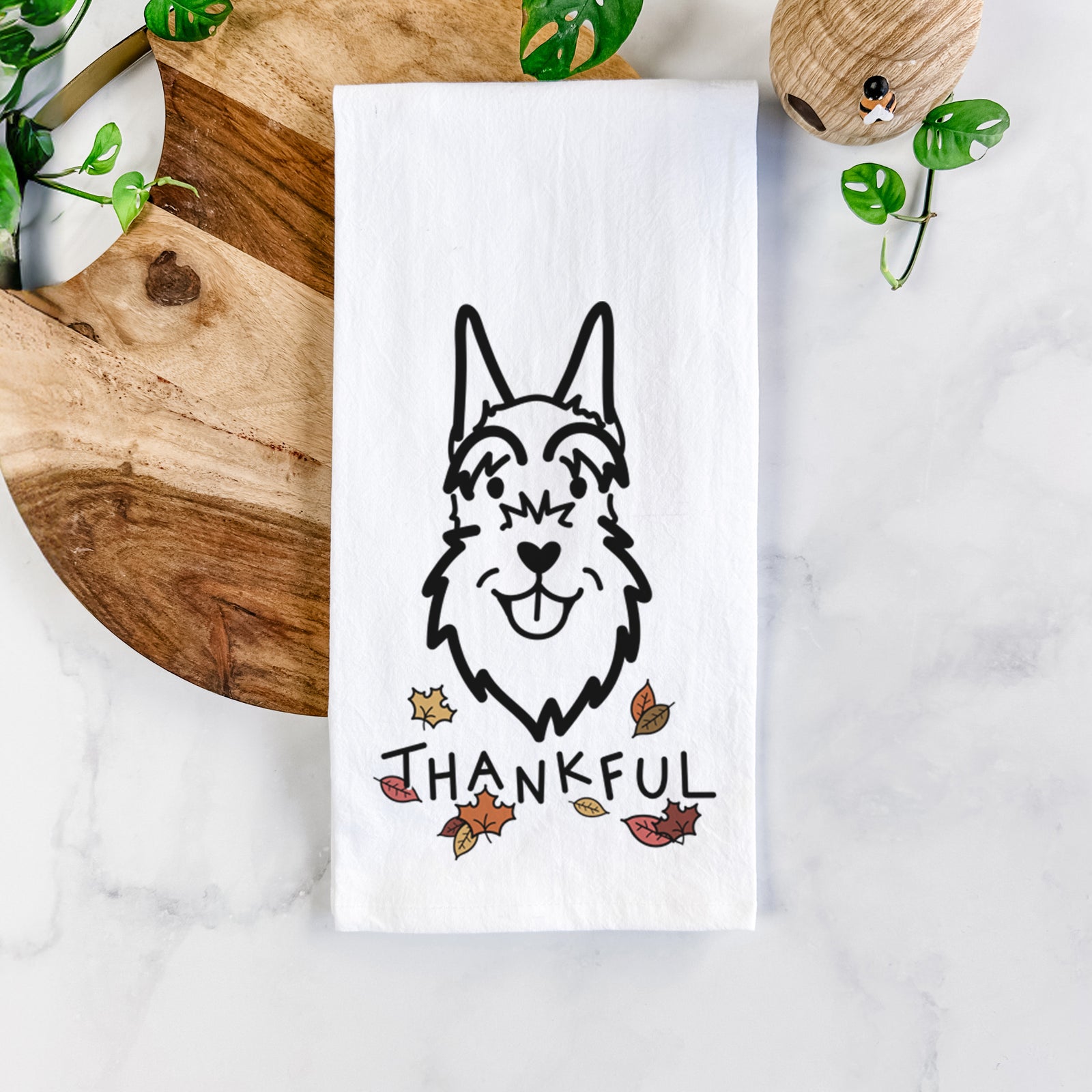 Minimalist line drawing of a Schnauzer Cropped Ears with 'Thankful' lettering on a tea towel