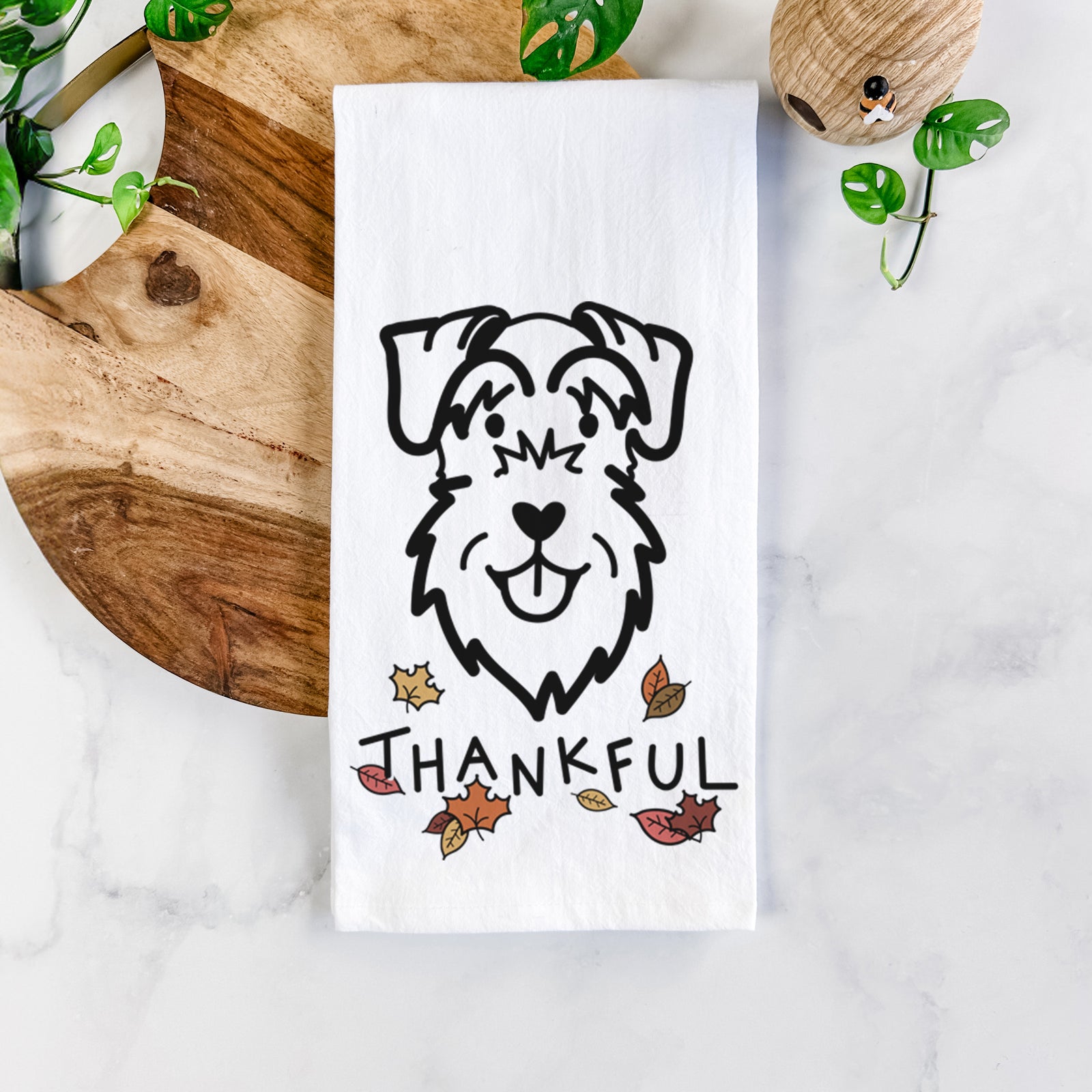 Minimalist line drawing of a Schnauzer Natural Ears with 'Thankful' lettering on a tea towel