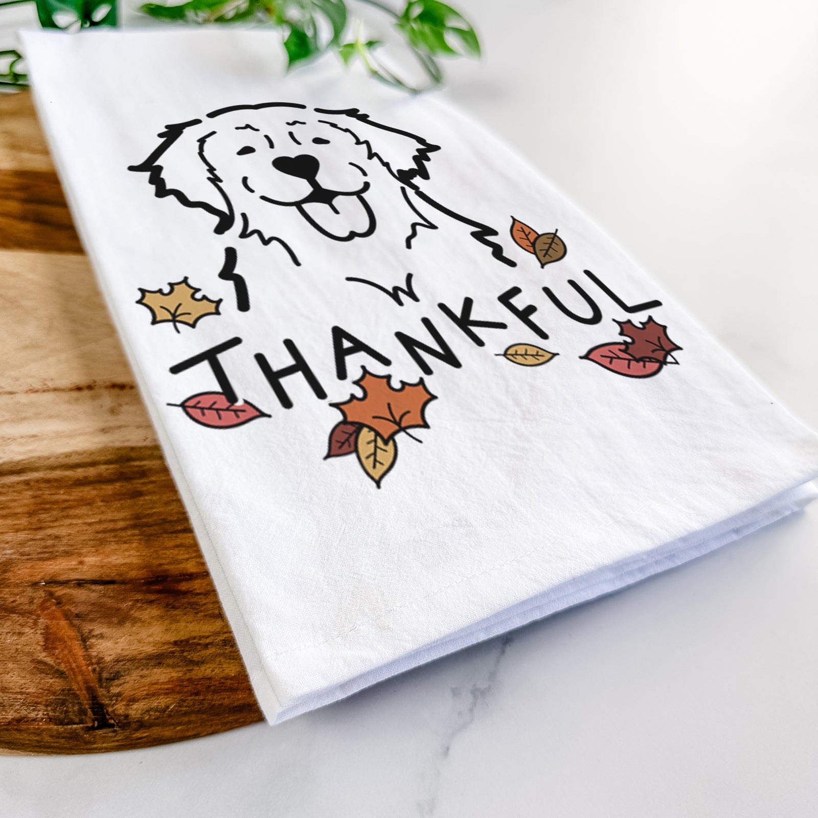 Minimalist line drawing of a Golden Retriever with 'Thankful' lettering on a tea towel