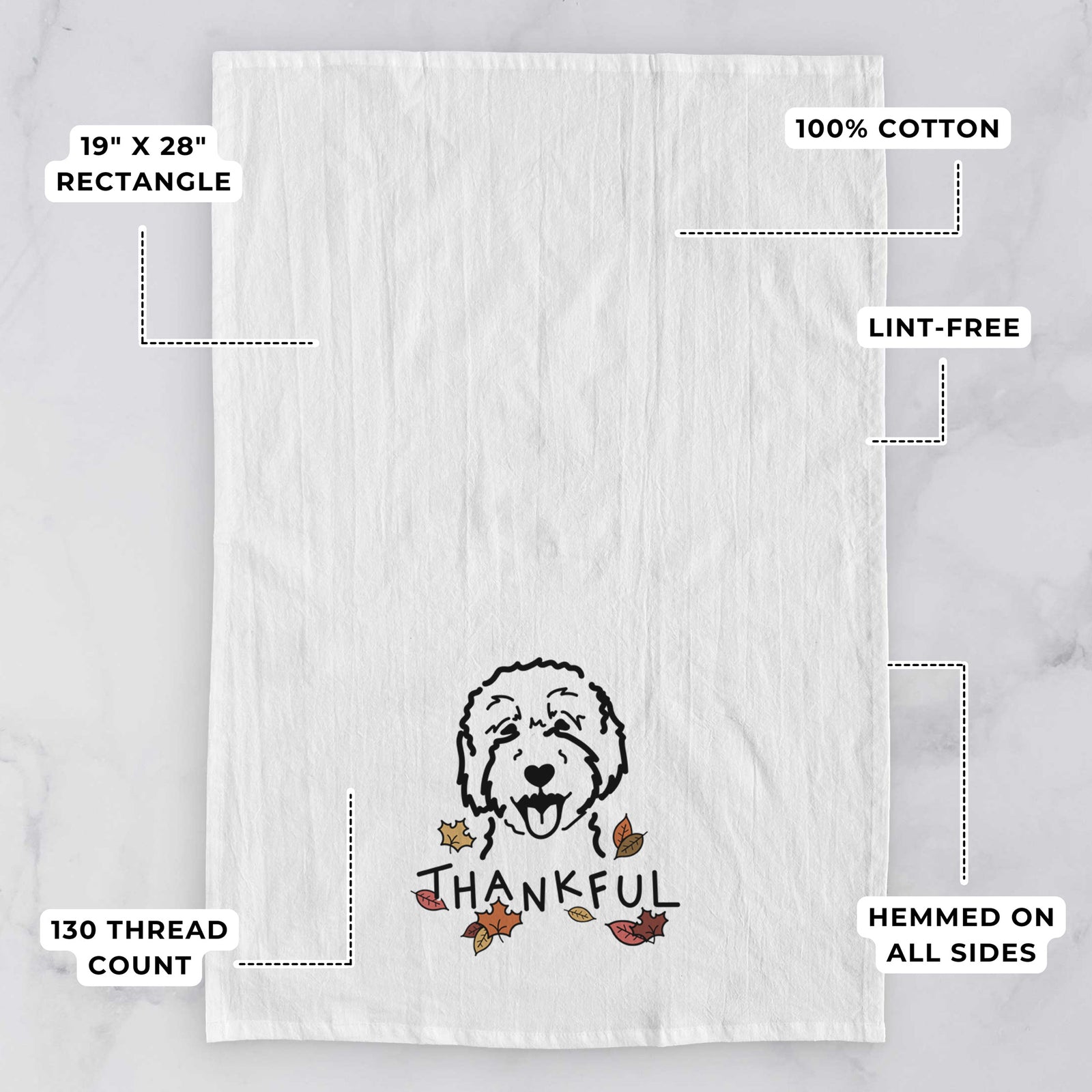 Minimalist line drawing of a Goldendoodle 2 with 'Thankful' lettering on a tea towel, with feature callouts: 19 x 28 inch rectangle, 100% cotton, lint-free, 120 thread count, hemmed on all sides