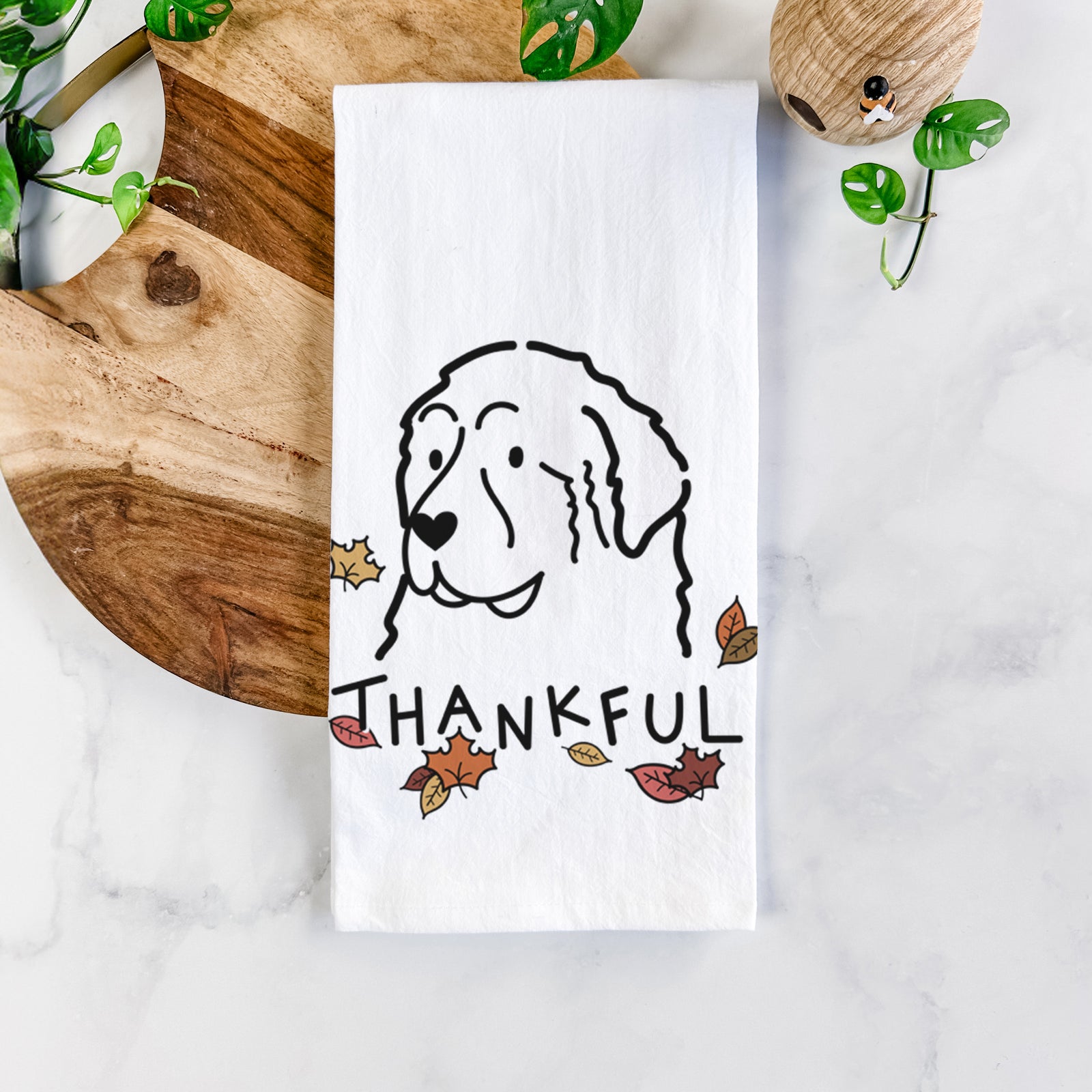 Minimalist line drawing of a Great Pyrenees with 'Thankful' lettering on a tea towel