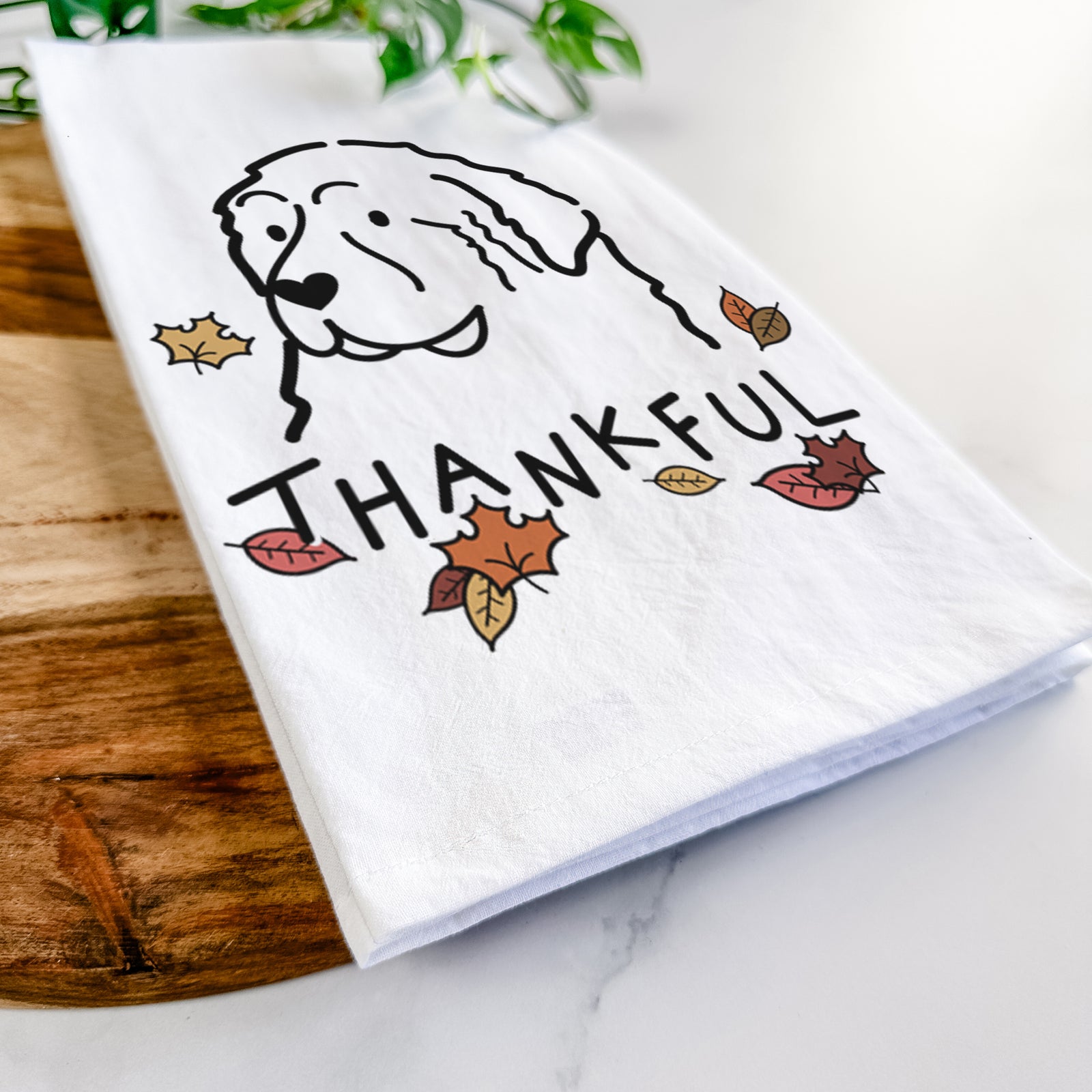Minimalist line drawing of a Great Pyrenees with 'Thankful' lettering on a tea towel