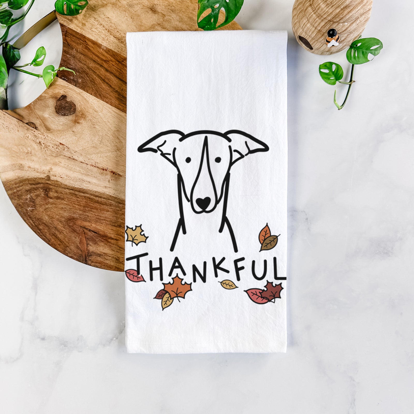 Minimalist line drawing of a Greyhound with 'Thankful' lettering on a tea towel