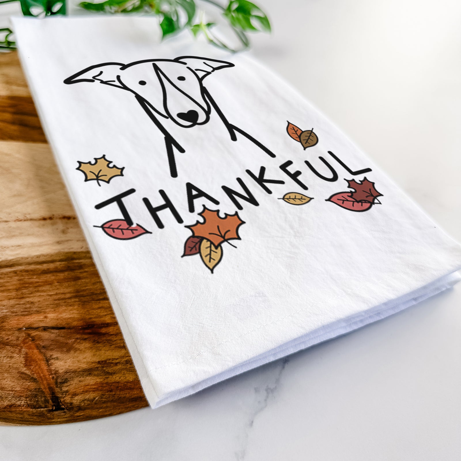 Minimalist line drawing of a Greyhound with 'Thankful' lettering on a tea towel