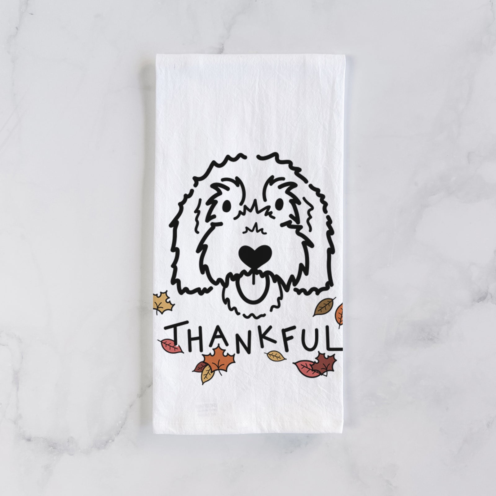 Minimalist line drawing of Gus the Goldendoodle with 'Thankful' lettering on a tea towel