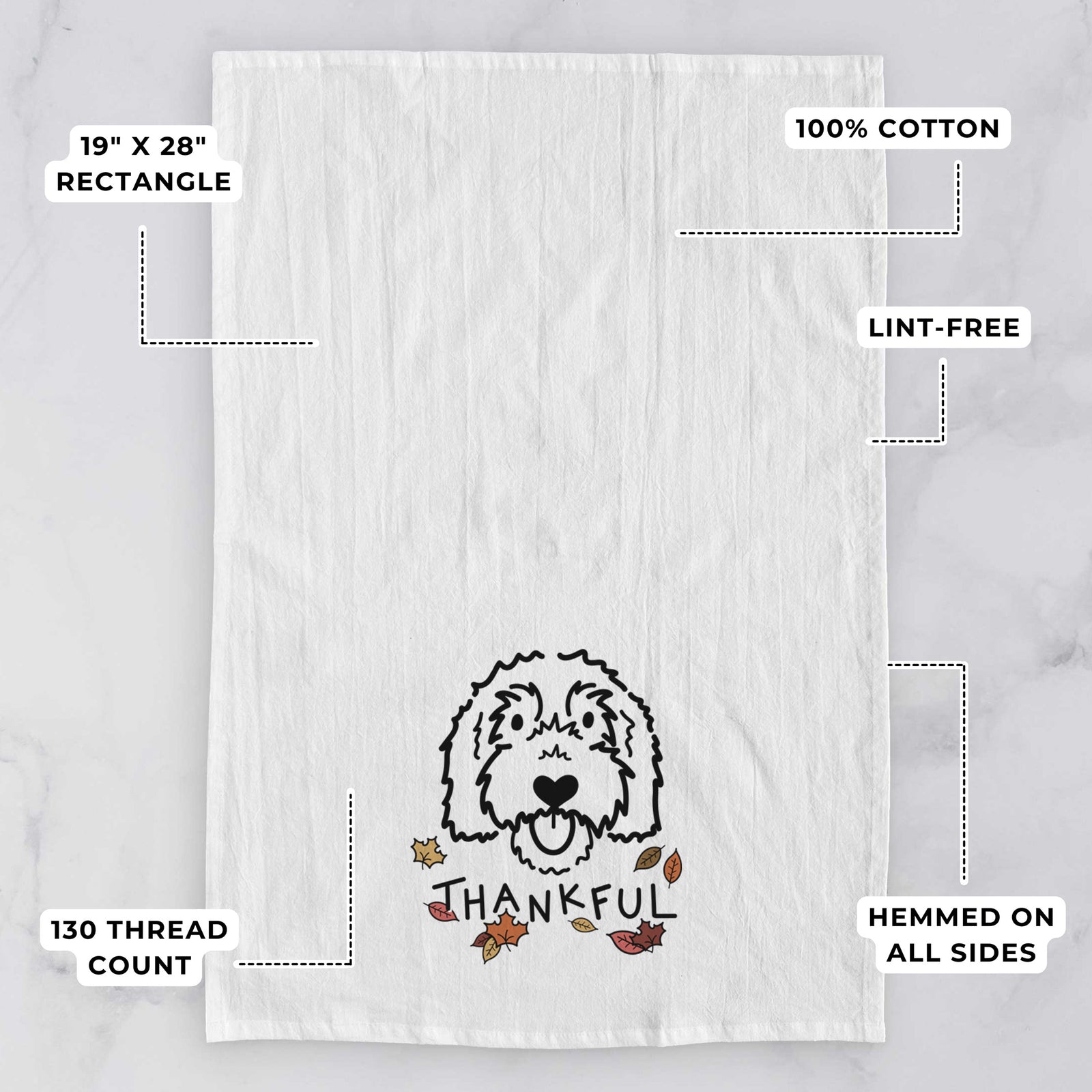 Minimalist line drawing of Gus the Goldendoodle with 'Thankful' lettering on a tea towel, with feature callouts: 19 x 28 inch rectangle, 100% cotton, lint-free, 120 thread count, hemmed on all sides