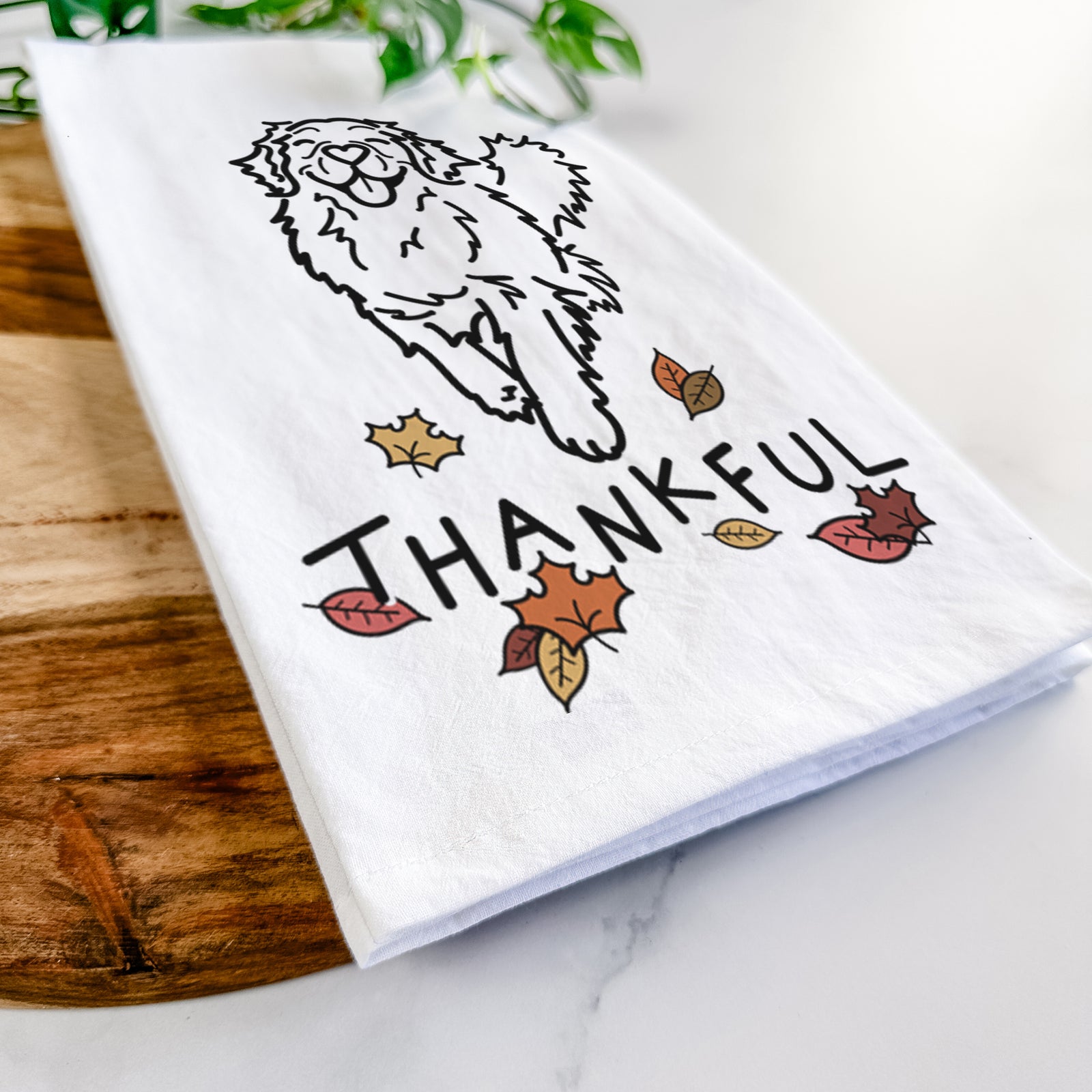 Minimalist line drawing of Hamlet the Golden Retriever with 'Thankful' lettering on a tea towel