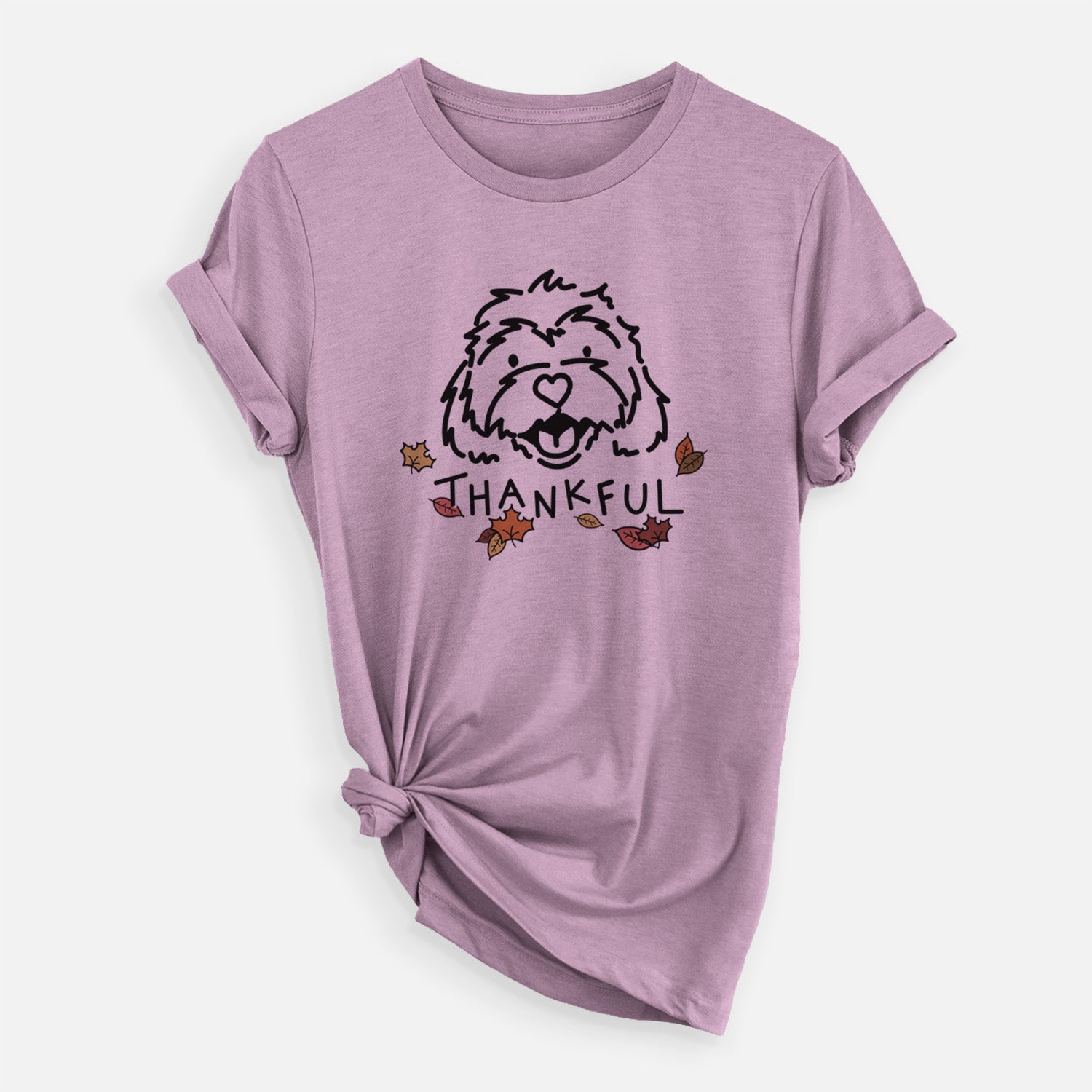 Minimalist line drawing of Harry the Cavachon with 'Thankful' lettering on an Orchid Unisex crewneck, worn by a woman