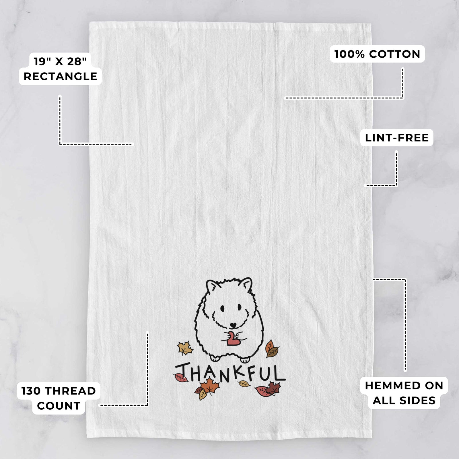 Minimalist line drawing of Hilga the Hamster with 'Thankful' lettering on a tea towel, with feature callouts: 19 x 28 inch rectangle, 100% cotton, lint-free, 120 thread count, hemmed on all sides