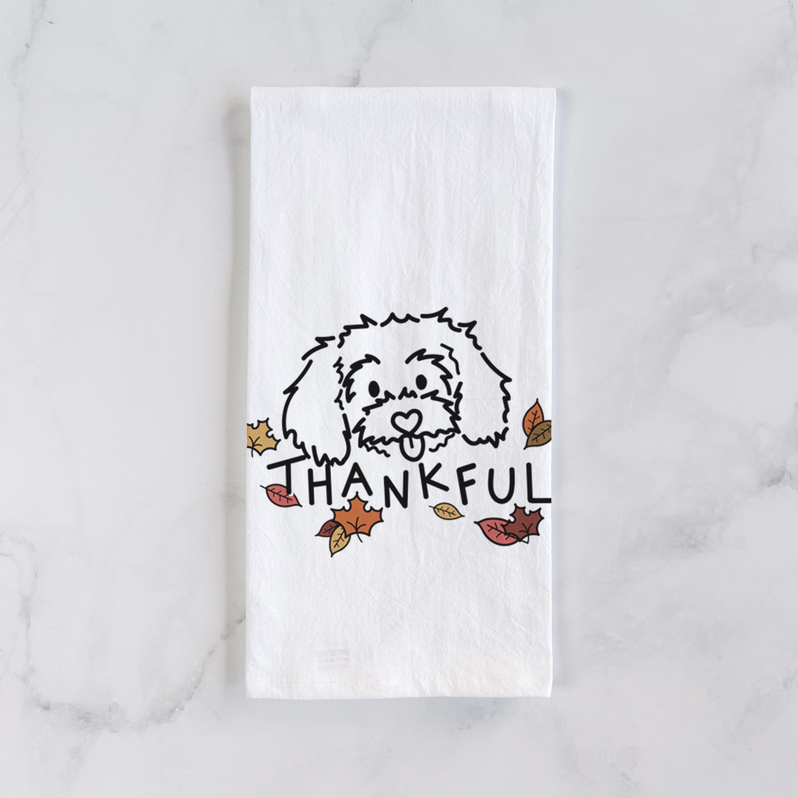 Minimalist line drawing of Holly the Maltipoo with 'Thankful' lettering on a tea towel