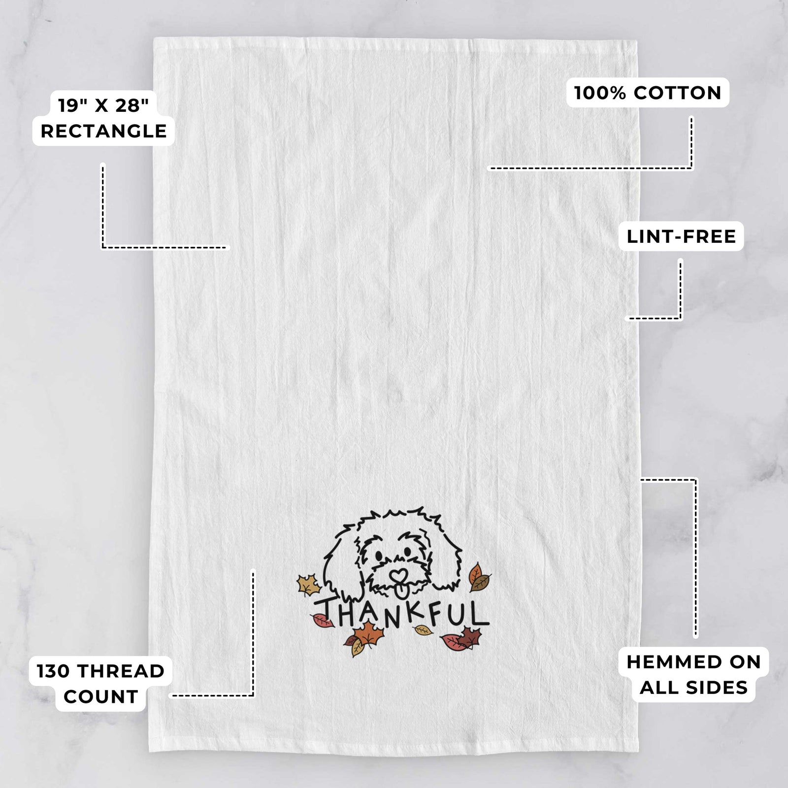 Minimalist line drawing of Holly the Maltipoo with 'Thankful' lettering on a tea towel, with feature callouts: 19 x 28 inch rectangle, 100% cotton, lint-free, 120 thread count, hemmed on all sides