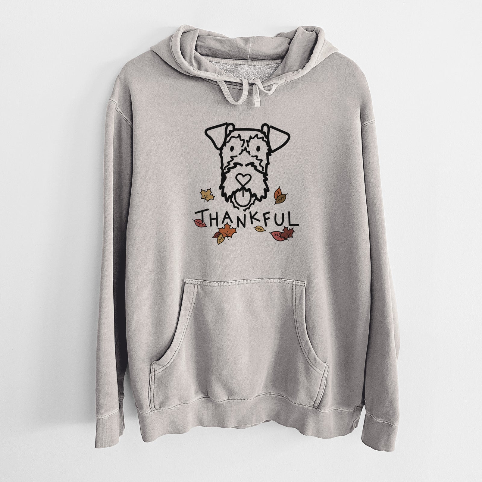 Minimalist line drawing of an Irish Terrier with 'Thankful' lettering on a Cement Unisex pigment dyed hoodie