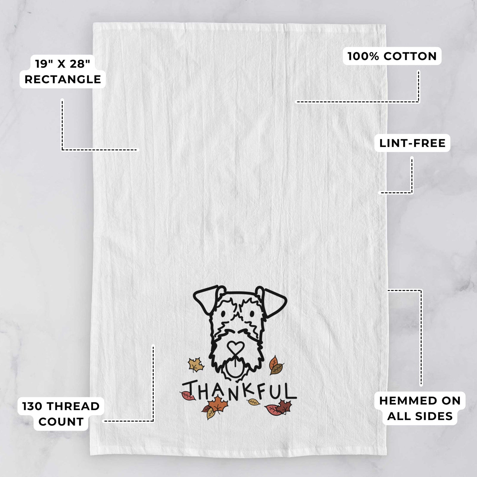 Minimalist line drawing of an Irish Terrier with 'Thankful' lettering on a tea towel, with feature callouts: 19 x 28 inch rectangle, 100% cotton, lint-free, 120 thread count, hemmed on all sides
