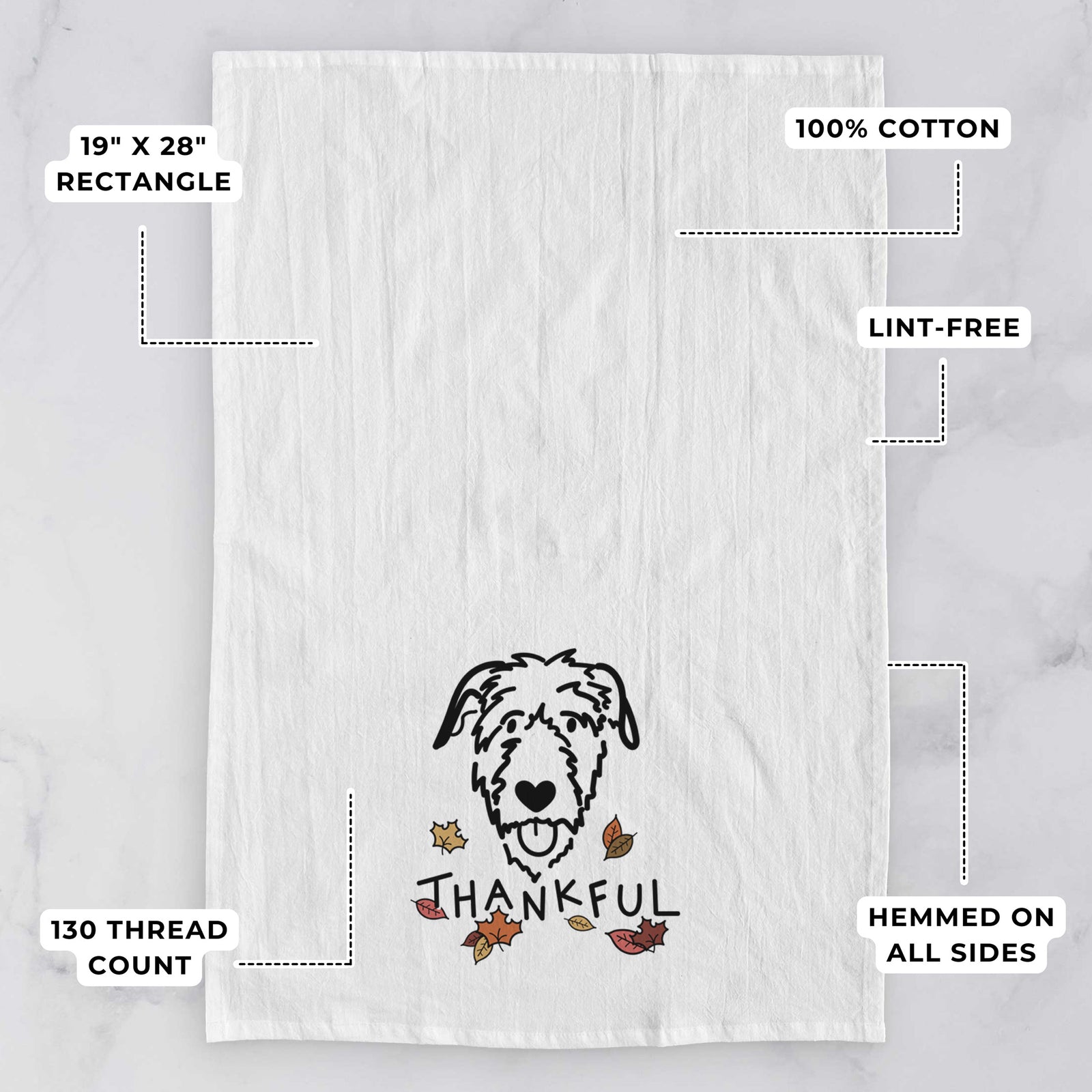 Minimalist line drawing of an Irish Wolfhound with 'Thankful' lettering on a tea towel, with feature callouts: 19 x 28 inch rectangle, 100% cotton, lint-free, 120 thread count, hemmed on all sides