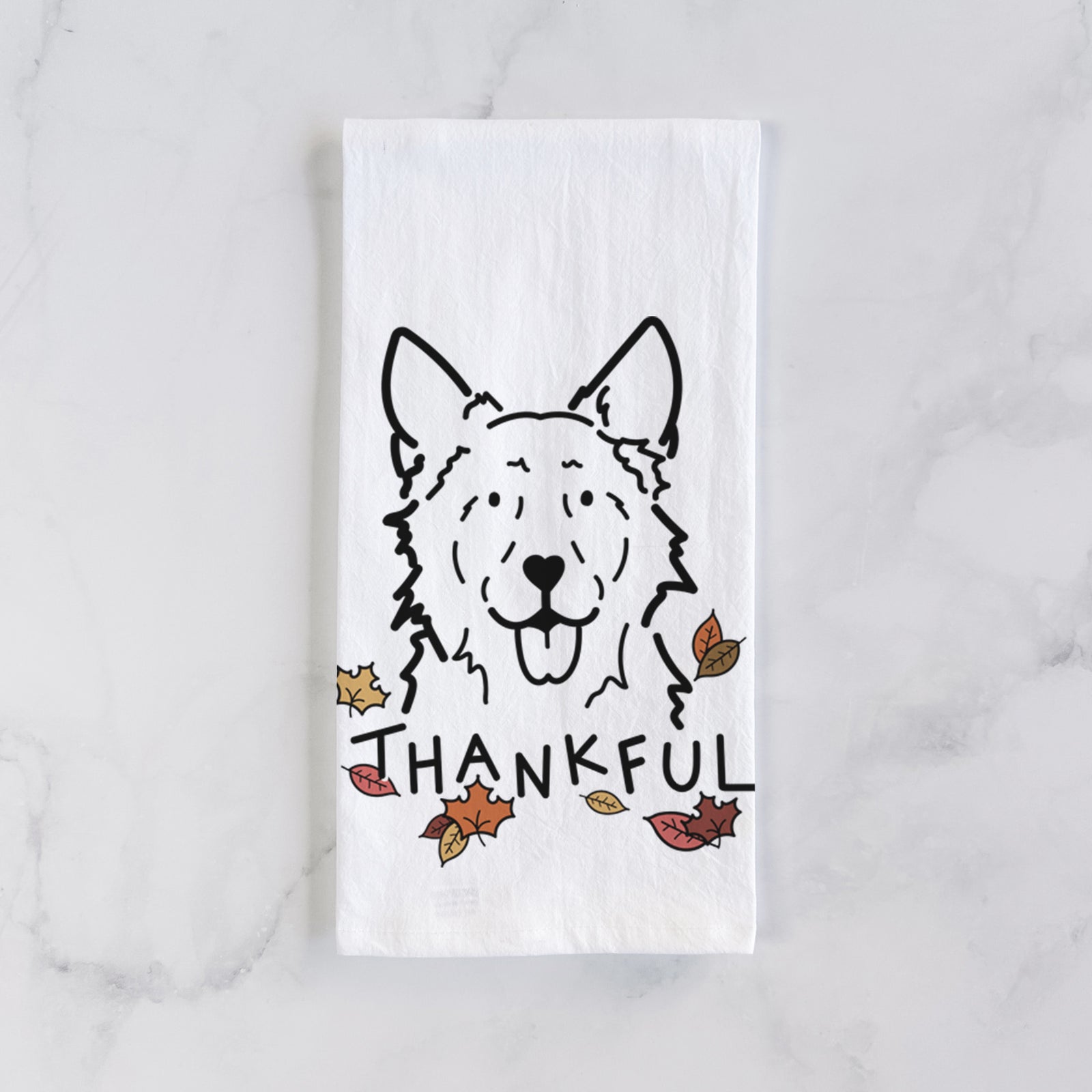 Minimalist line drawing of Jack the Mudi with 'Thankful' lettering on a tea towel