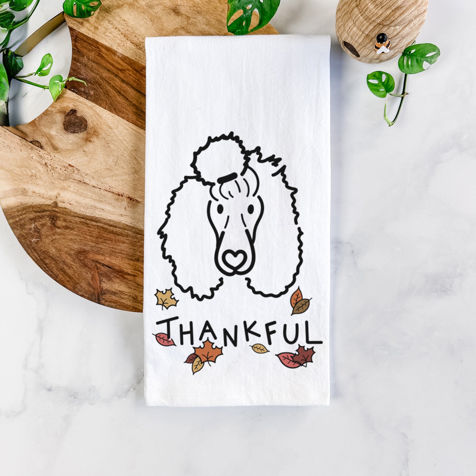 Minimalist line drawing of Jemma the Standard Poodle with 'Thankful' lettering on a tea towel