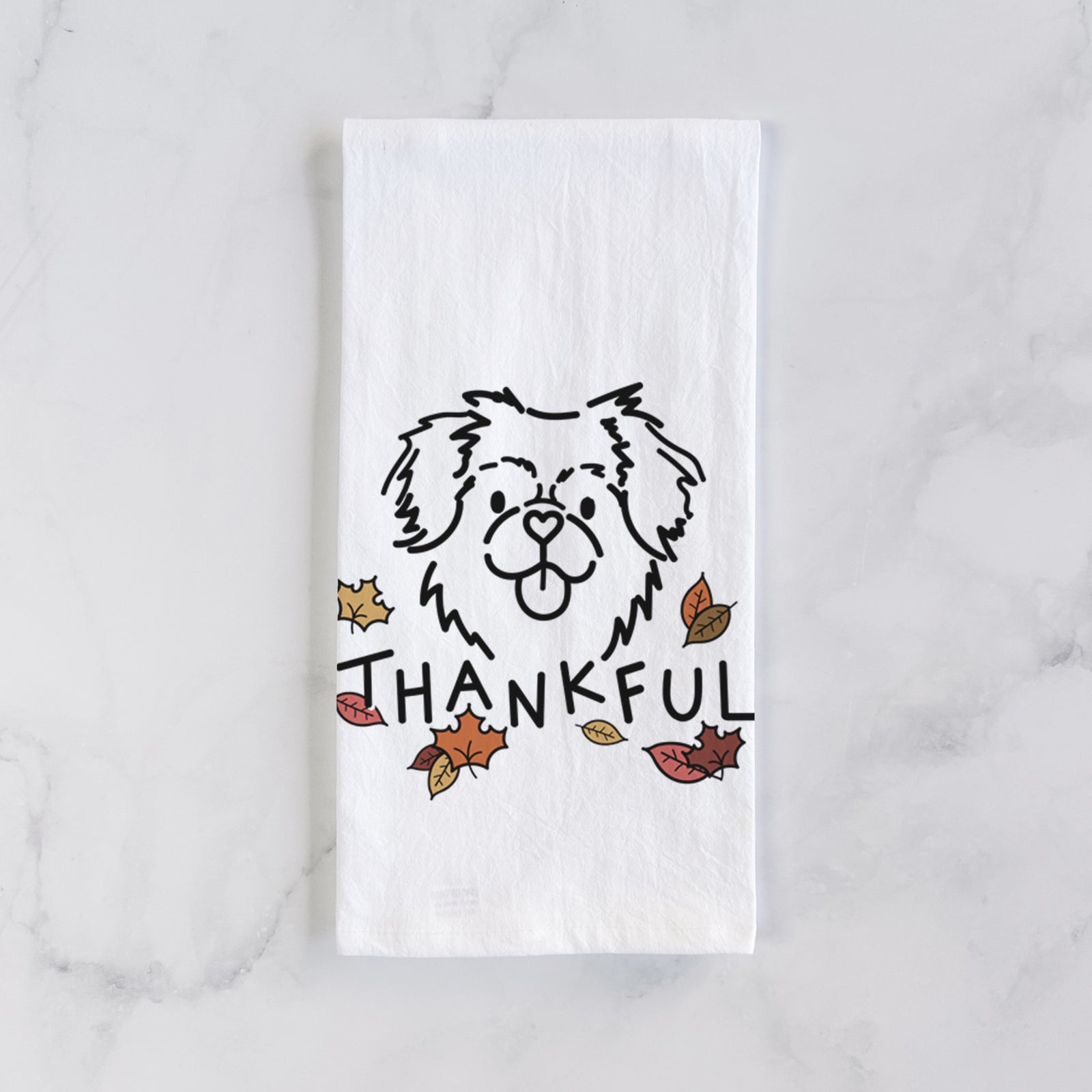 Minimalist line drawing of Jiji the Tibetan Spaniel with 'Thankful' lettering on a tea towel