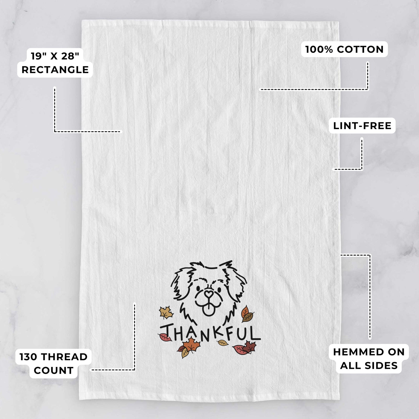 Minimalist line drawing of Jiji the Tibetan Spaniel with 'Thankful' lettering on a tea towel, with feature callouts: 19 x 28 inch rectangle, 100% cotton, lint-free, 120 thread count, hemmed on all sides