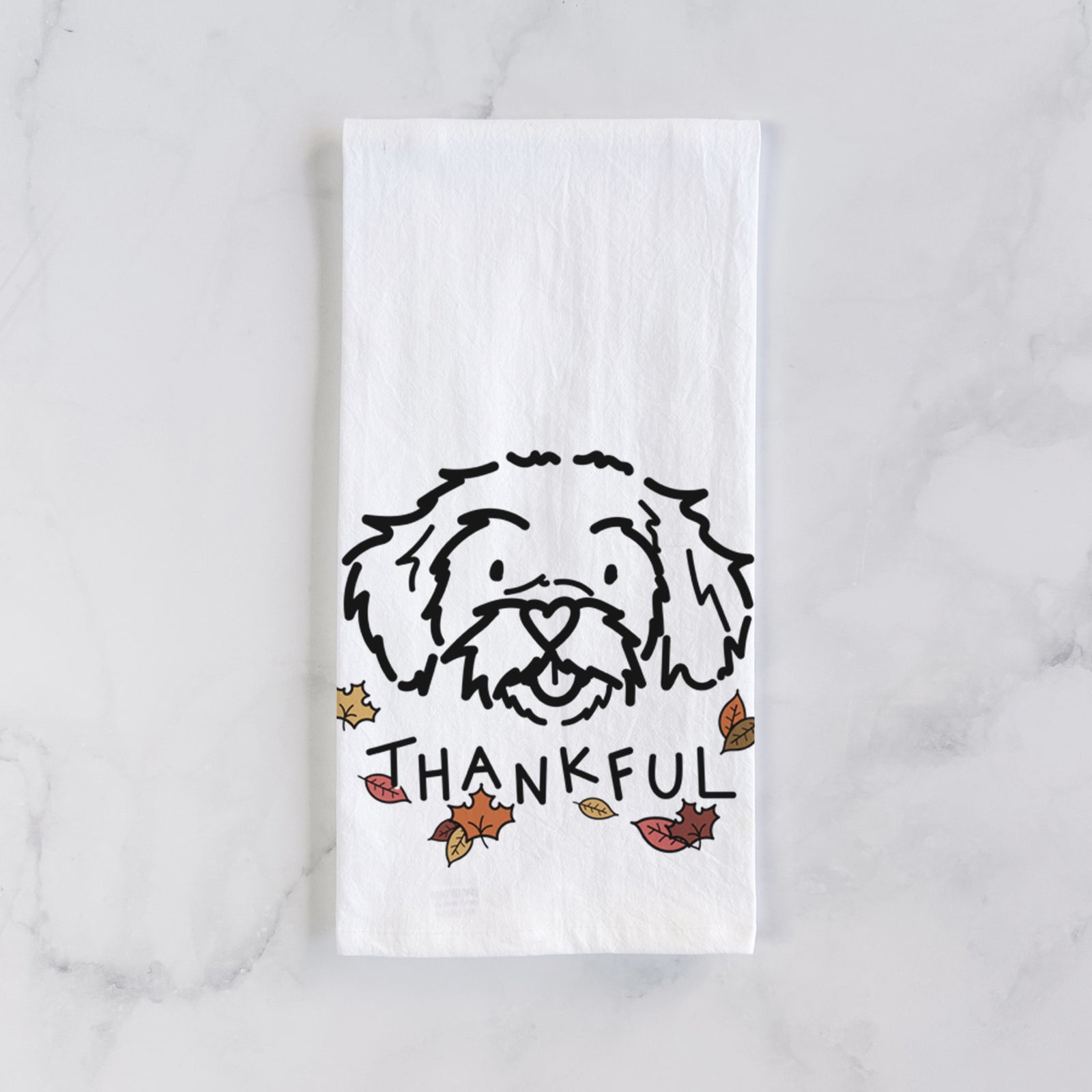 Minimalist line drawing of Jo Jo the Peekapoo with 'Thankful' lettering on a tea towel