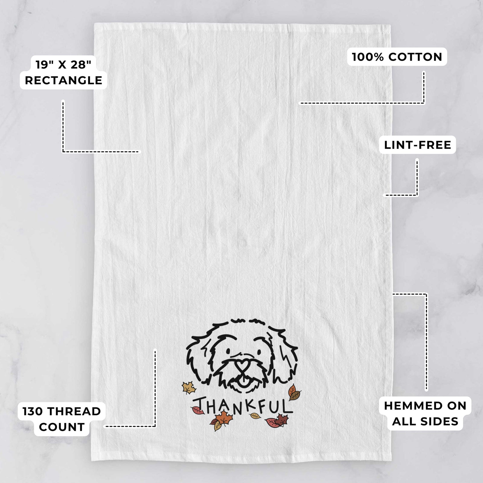Minimalist line drawing of Jo Jo the Peekapoo with 'Thankful' lettering on a tea towel, with feature callouts: 19 x 28 inch rectangle, 100% cotton, lint-free, 120 thread count, hemmed on all sides