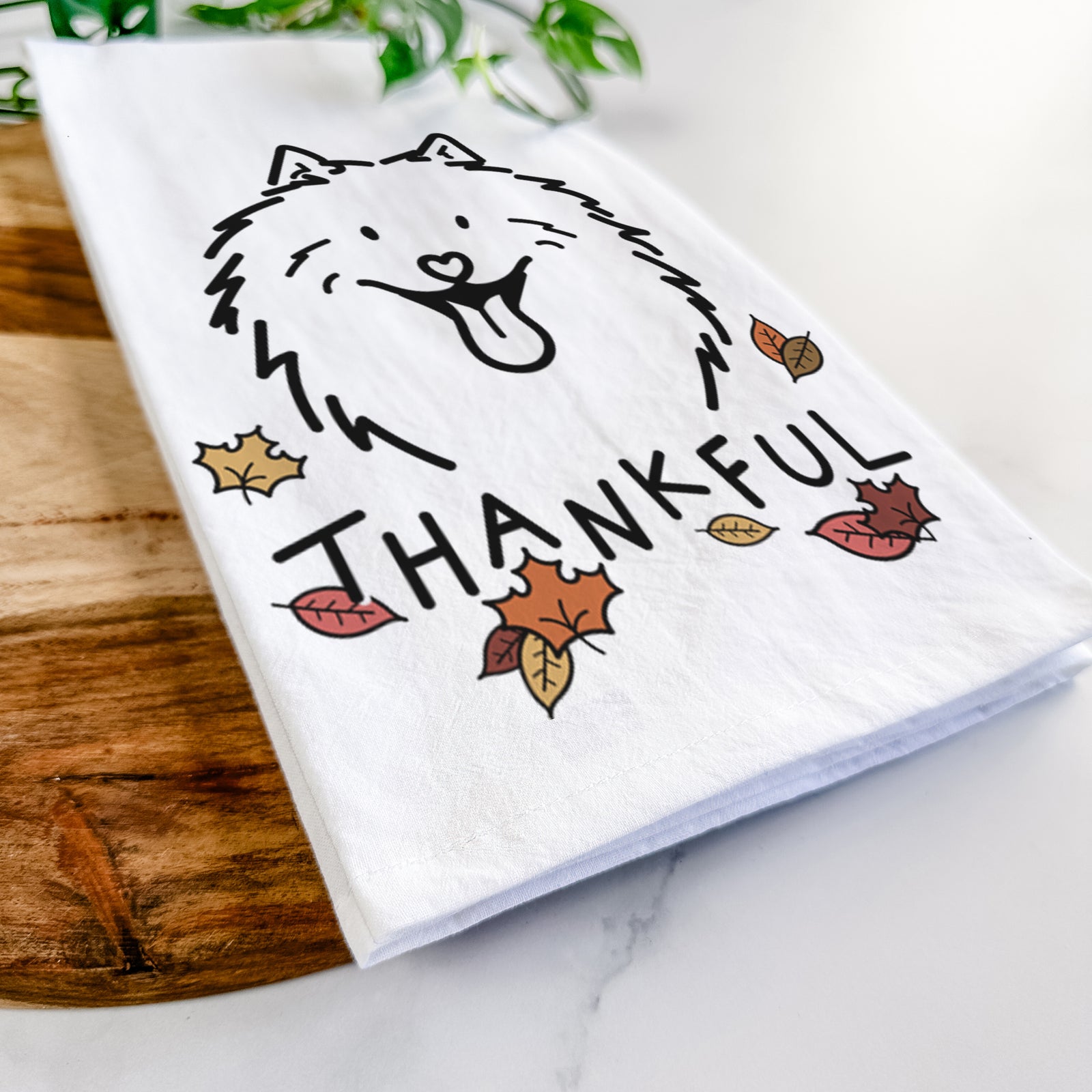Minimalist line drawing of Johnny the Samoyed with 'Thankful' lettering on a tea towel