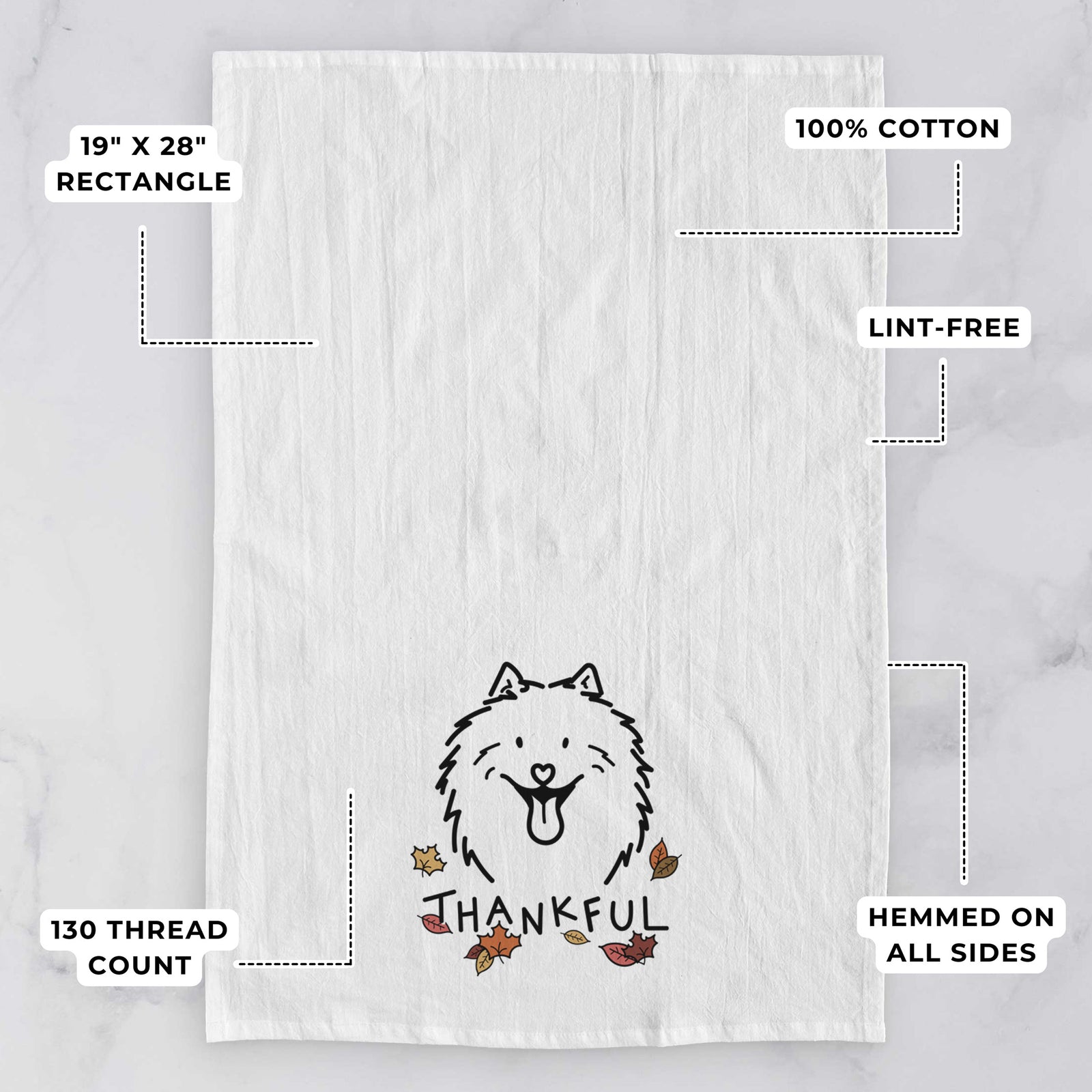 Minimalist line drawing of Johnny the Samoyed with 'Thankful' lettering on a tea towel, with feature callouts: 19 x 28 inch rectangle, 100% cotton, lint-free, 120 thread count, hemmed on all sides