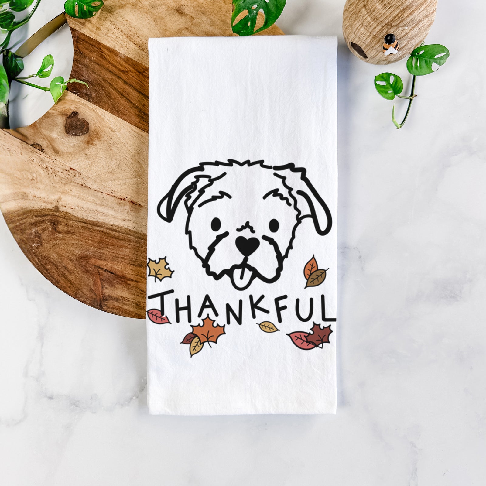 Minimalist line drawing of Koko the Shih Tzu with 'Thankful' lettering on a tea towel
